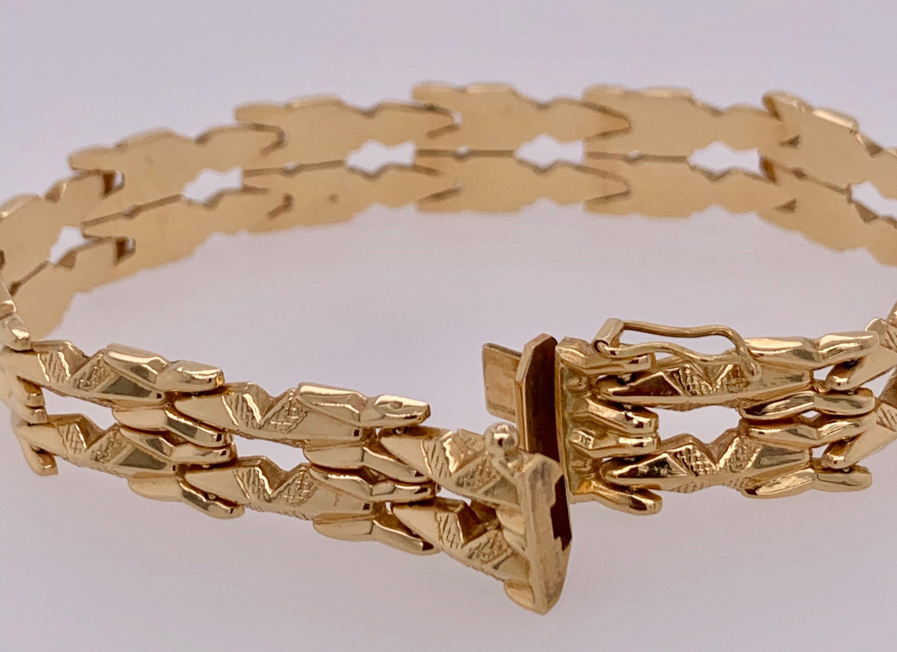 18 Karat Yellow Gold Link Bracelet . Seven Inches long stamped 750 bearing makers mark. 11.25mm wide. 15.3 grams. 