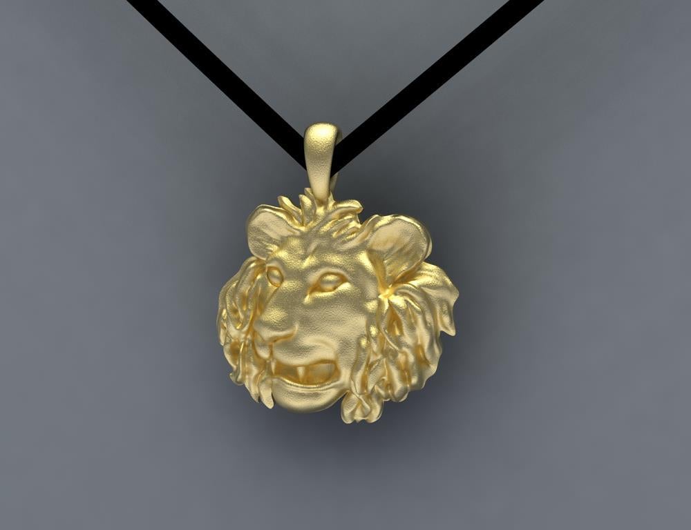 Tiffany Designer , Thomas Kurilla created this 18 Karat Yellow Gold Lion Pendant, For the Leo in your life. Polished 18 mm x 3.5 mm or 11/16th inch x 1/8 inch. On a thin flat ultra suede cord 1/8 inch  32 inches long.
  I am really a sculptor, so