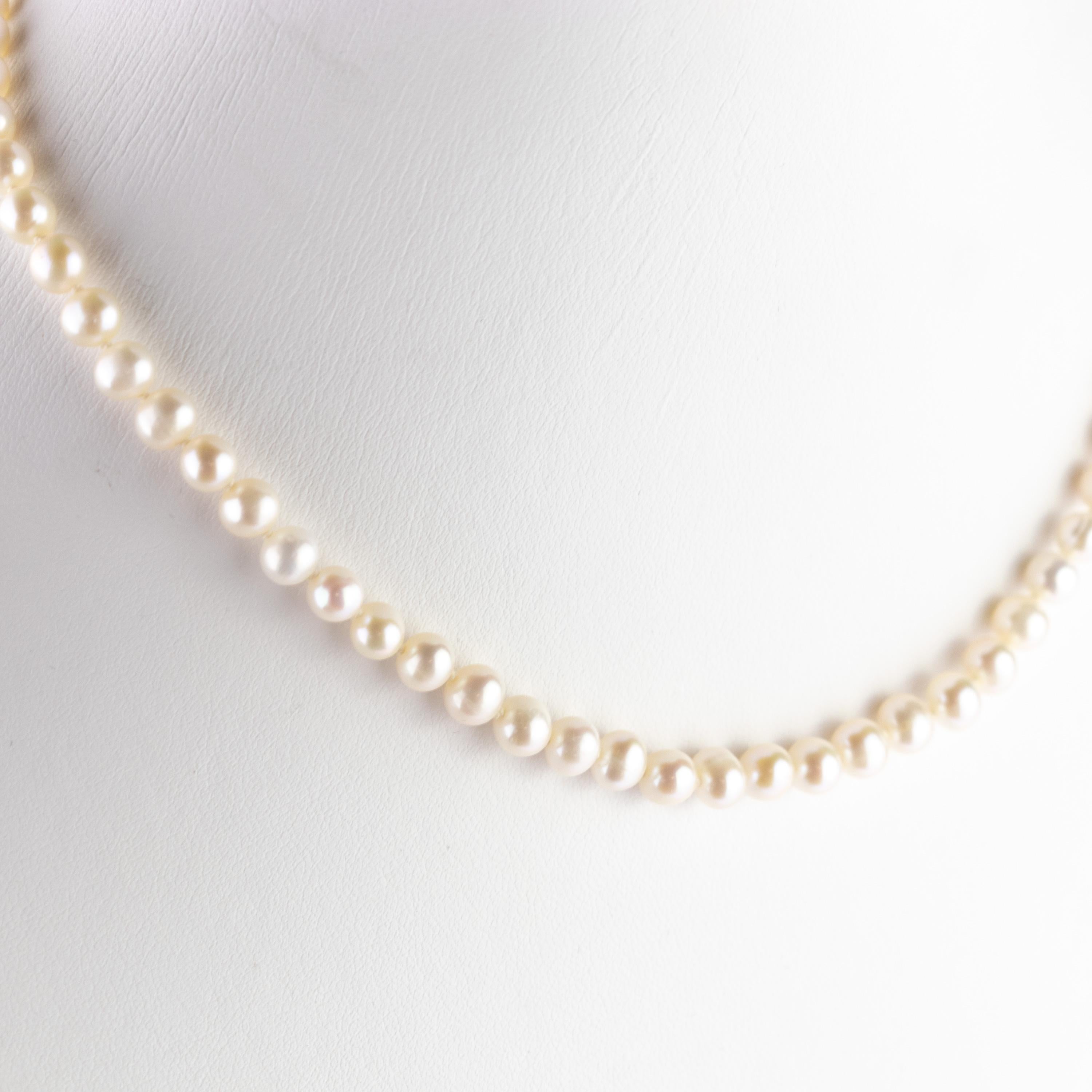 Timeless design first class freshwater pearls with a gentle lobster claw closure in 18k yellow gold. This design shows the simple and unique beauty of a special accessory that will surely enrich with beauty whoever wears it.  An iconic choker for an
