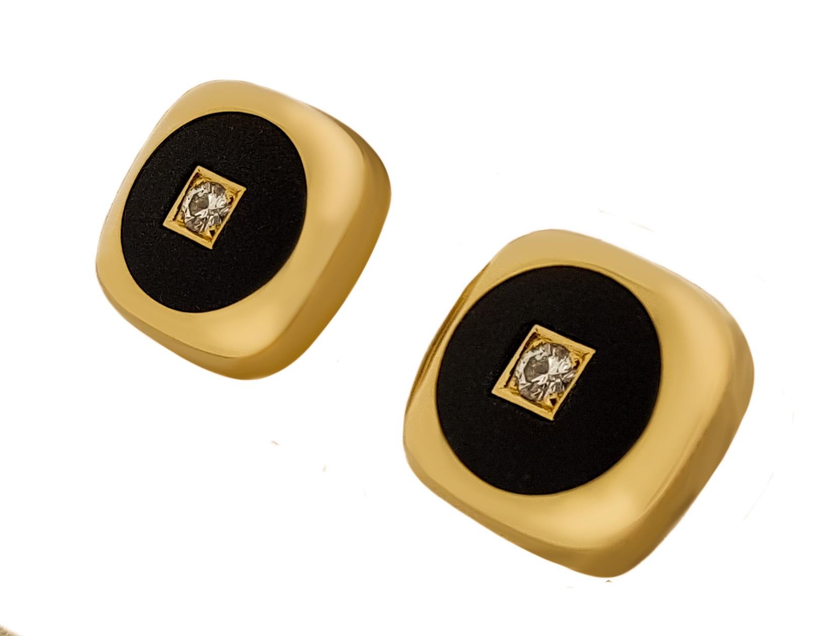 Sleek and sophisticated, solid 18kt high polished yellow gold cufflinks with sandblasted matte black onyx inlay with a single, full cut, round brilliant diamond in each. Diamonds equal .18ctw and are a F-G in color and VS in clarity.  Stamped 