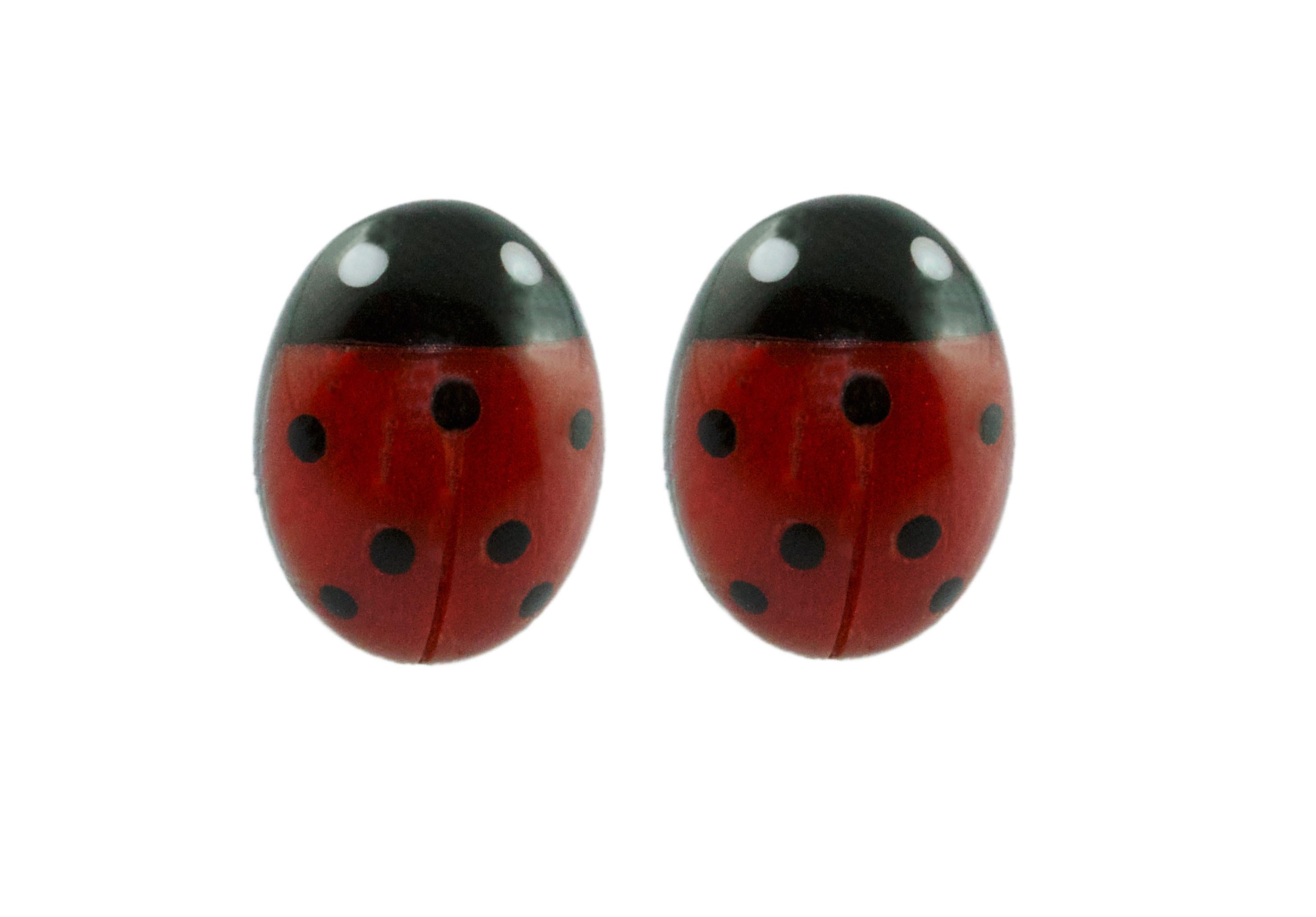 These stud earrings are made with coral sourced in the Mediterranean and Onyx, each face have been hand-carved shaped like a ladybug with a smooth, bulging surface.  
The post in the back is made of 18 karat yellow  gold.

All AVGVSTA jewelry is new