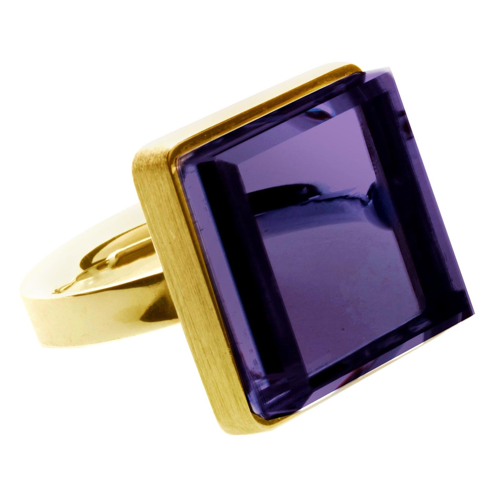 This contemporary jewellery ring, featuring a 15x15x8 mm dark grown amethyst, is crafted in 18 karat yellow gold and has been featured in Harper's Bazaar and Vogue UA. It can be ordered with lighter natural amethyst for the same price.

Reflecting