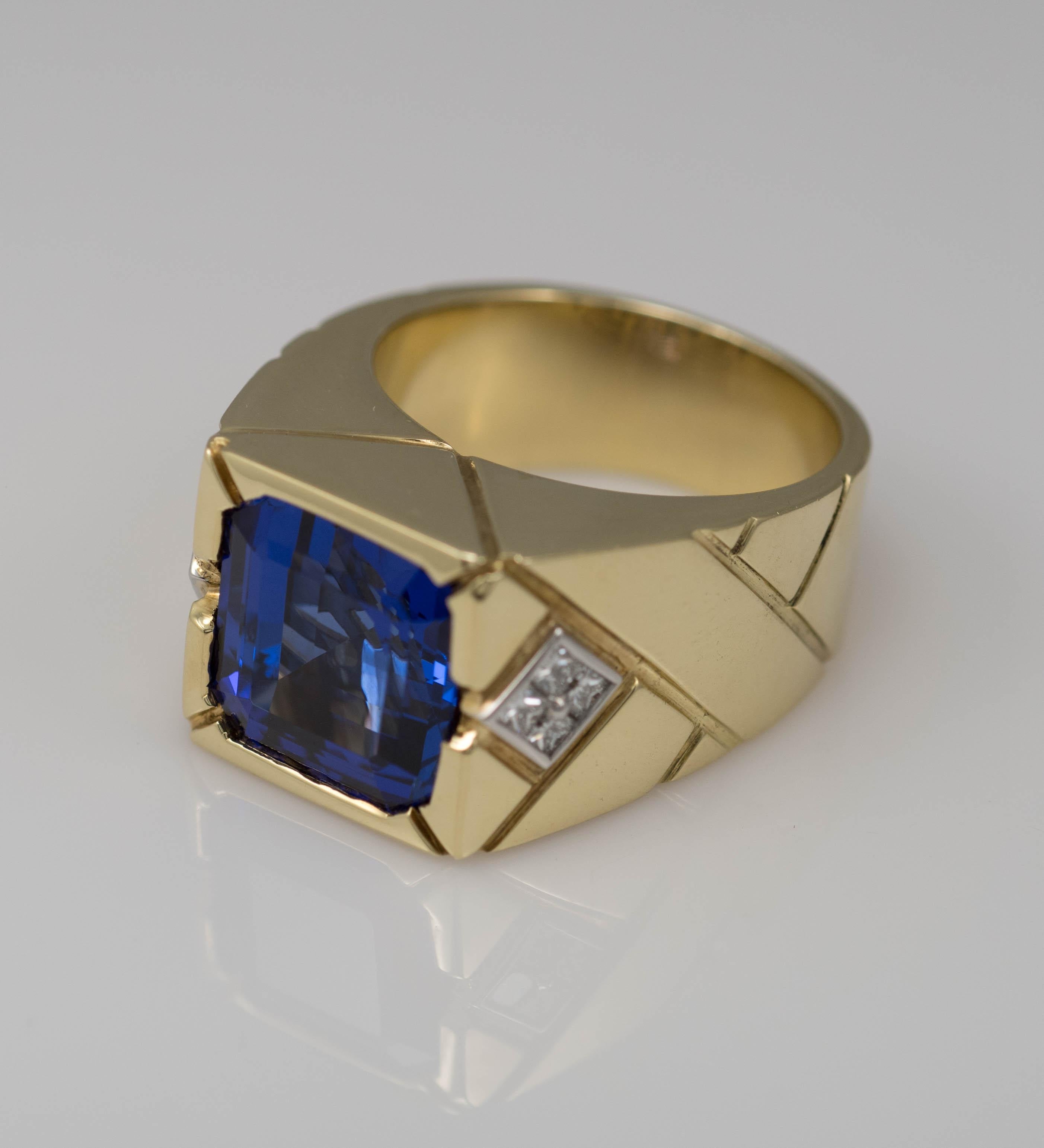Men’s Custom Made Tanzanite And Diamond Ring In 18k Yellow Gold. Tests 18k And Weighs 38.7 Grams. Size 10.75
The Tanzanite Is An Emerald Cut, 11.55 Carats, Extra Fine, Bluish- Violet Color, Excellent Cut. (Dimensions 13.14 X 12.52 X 8.82mm).
On The