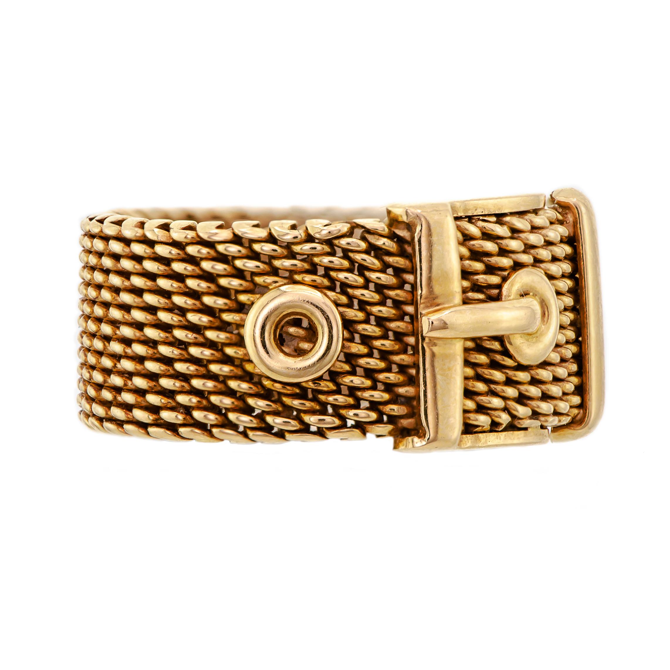 A delightful vintage 18K yellow gold flexible mesh belt band ring featuring a fun buckle design. This ring measures approximately 3/8