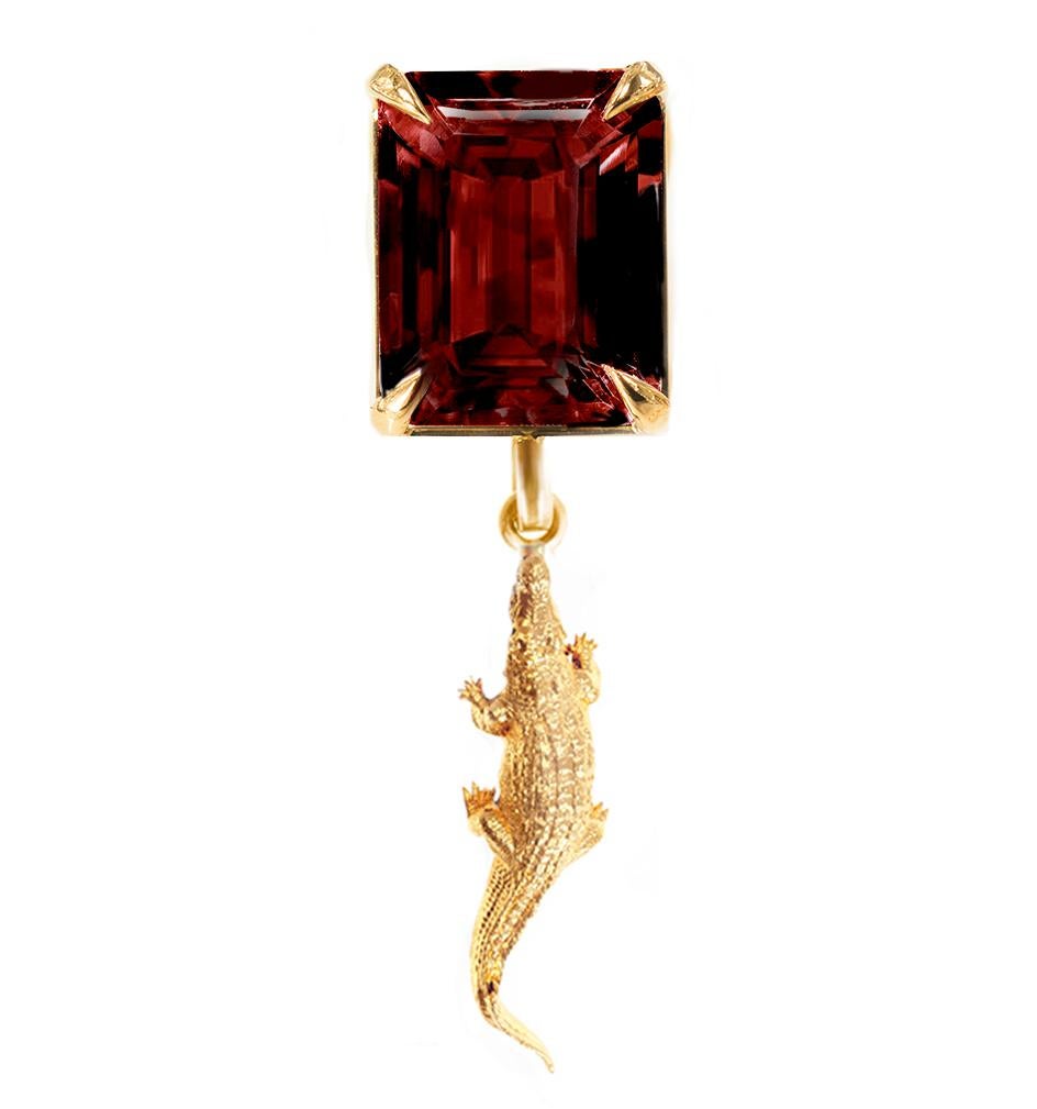 This contemporary Mesopotamian Brooch is crafted from 18 karat yellow gold with a rhodolite garnet (12x10 mm, octagon cut) at its center. It is part of the new Mesopotamia collection, designed by oil painter Polya Medvedeva from Berlin. The brooch