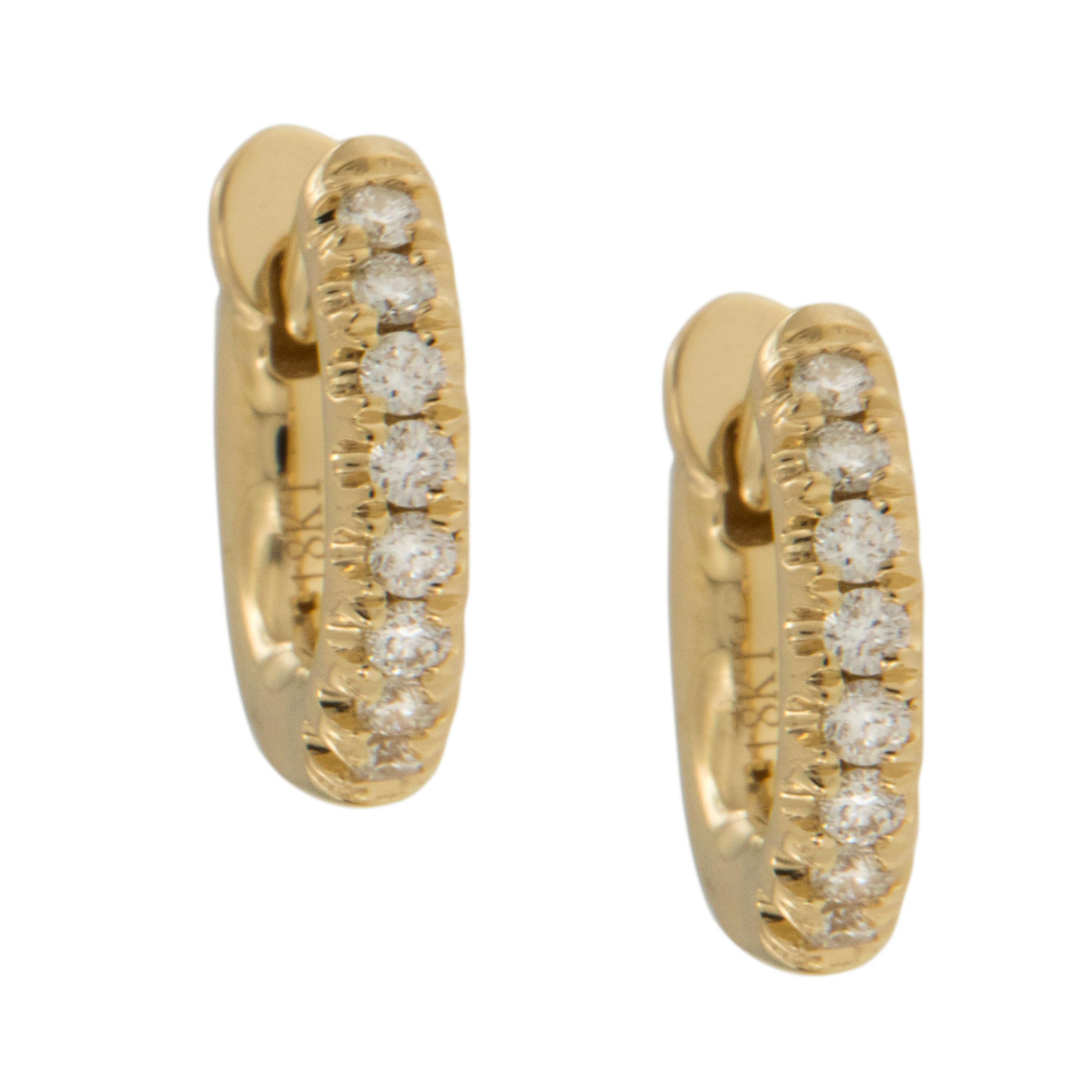 How adorable are these diamond hoop earrings? Perfect for every day wear or the office, especially with no backing to poke your neck! Made from royal 18 karat yellow gold these mini diamond huggy hoops are set with 0.12 Cttw diamonds. They are 2mm