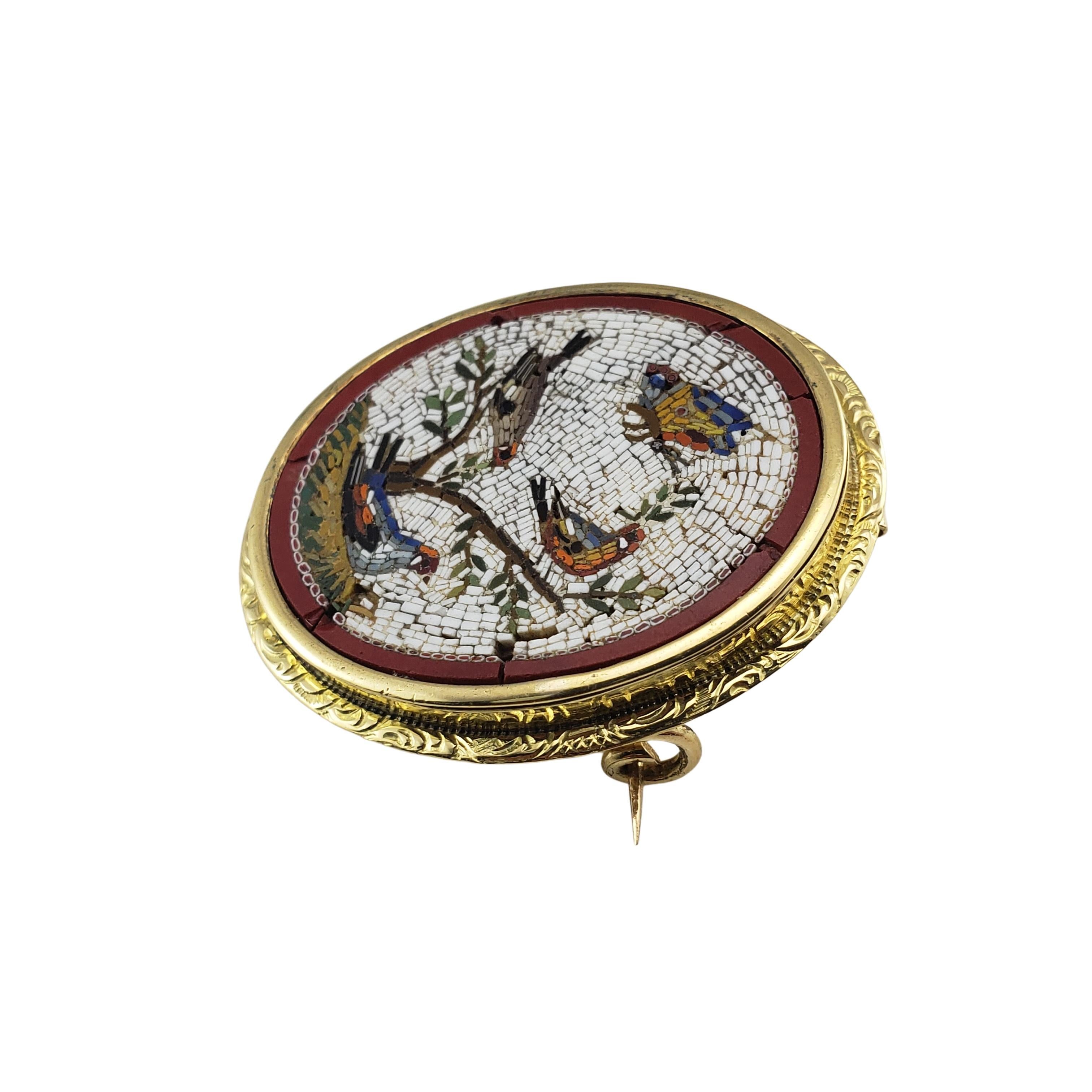 18 Karat Yellow Gold Micro Mosaic Brooch/Pin-

This elegant mosaic brooch depicts a lovely bird scene set in beautifully detailed 18K yellow gold.

*Please note - some mosaic tiles are missing and/or damaged.

Size: 34 mm x 28 mm

Weight:  7.2 dwt.