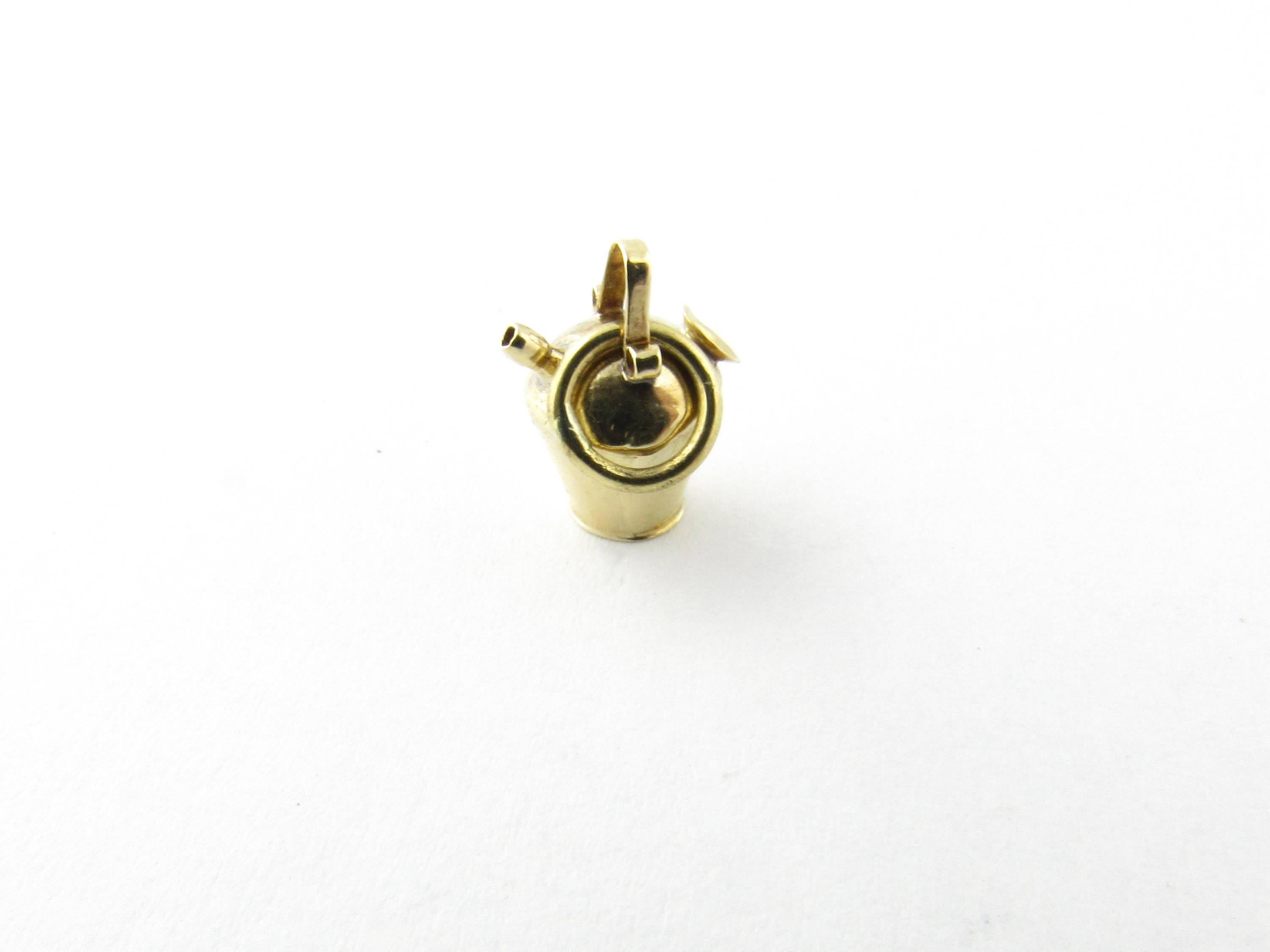 Vintage 18 Karat Yellow Gold Milk Can Charm
This lovely charm depicts a miniature old-fashioned milk can meticulously detailed in 18K yellow gold. 
Size:  12 mm x  8 mm (actual charm) 
Weight:  0.3 dwt. /  0.5 gr. 
Hallmark: Acid tested for 18K