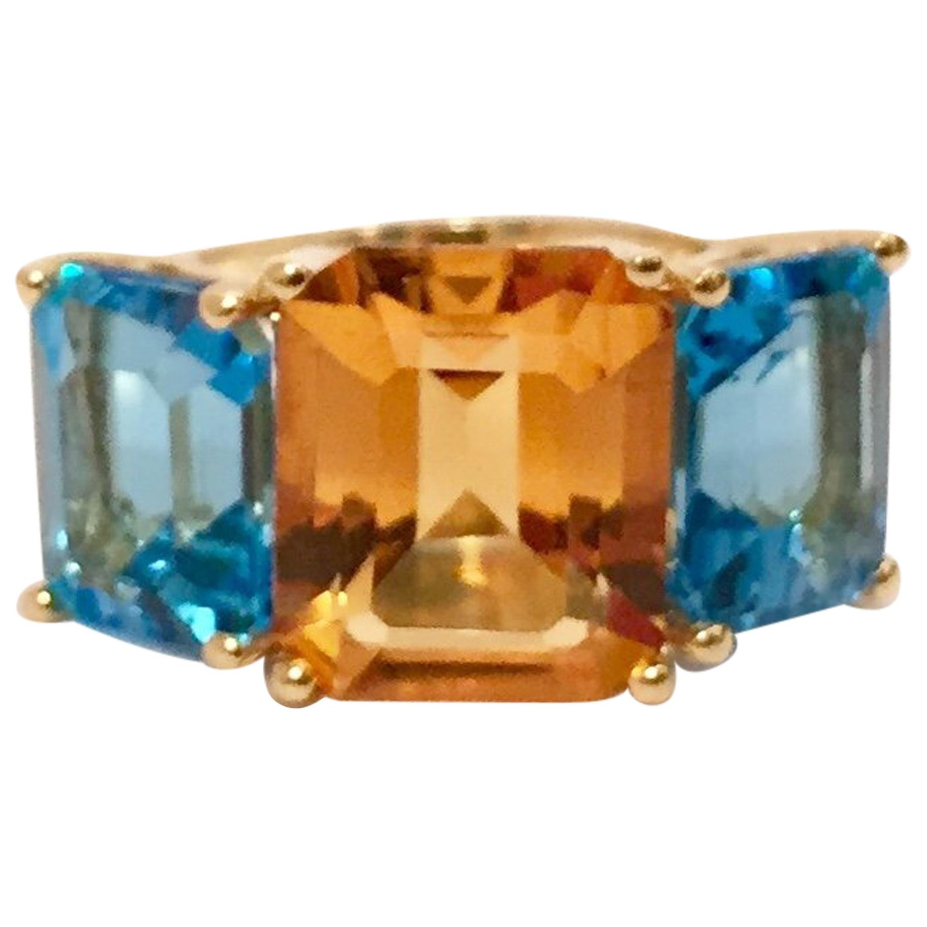 18 Karat Yellow Gold Mini Emerald Cut Ring with Orange Citrine and Blue Topaz For Sale