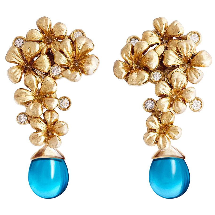Boucles d'oreilles modernes en or jaune avec diamants ronds présentées dans Vogue en vente