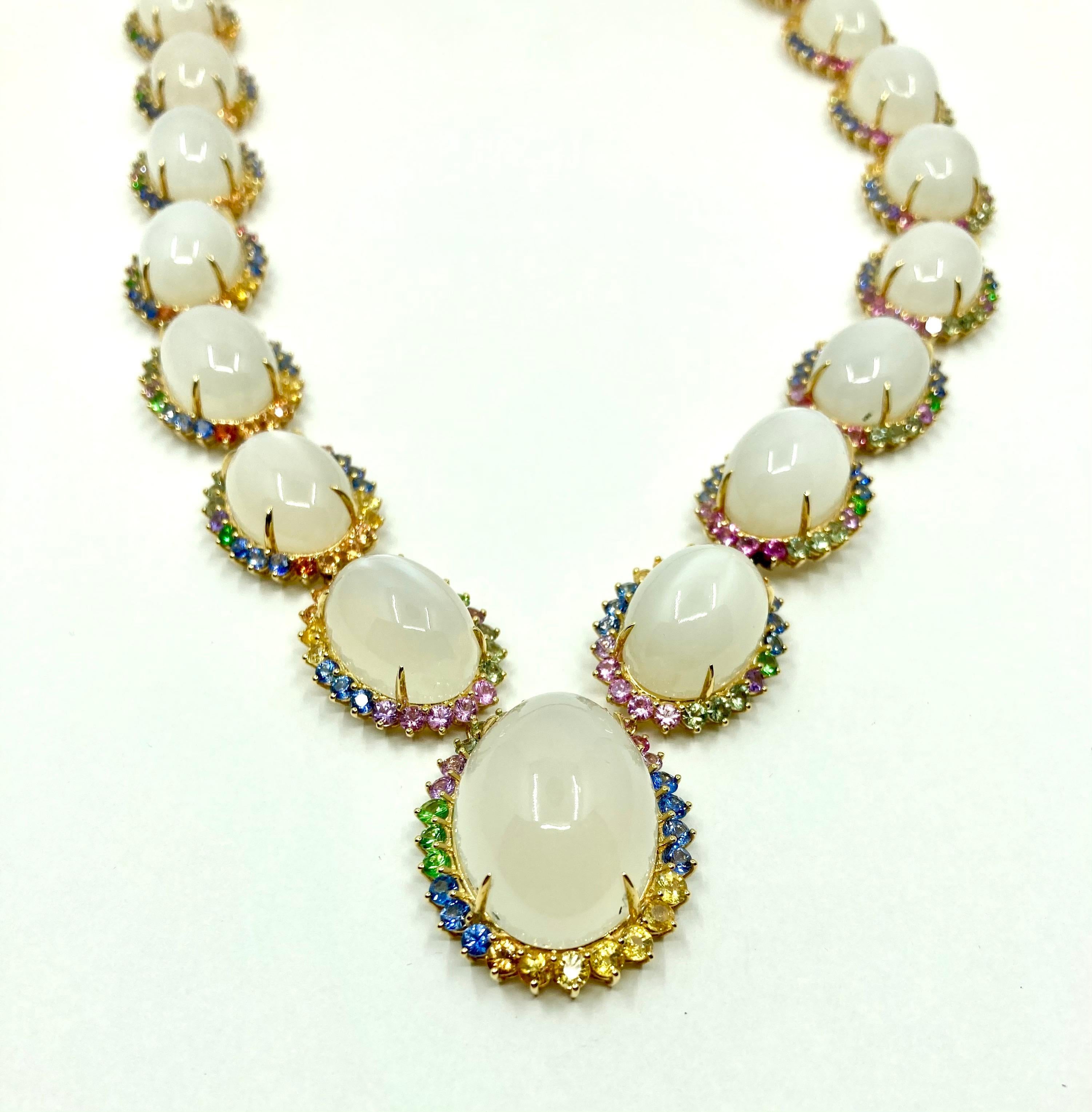 Timeless elengat Yellow Gold Necklace with Multicolor Sappires (blue, green, yellow, purple) ct. 38.04, Tsavorite ct. 1.62 and White Moonstone ct. 311.25 , Made in Italy by Roberto Casarin.

A simple yet refined design, this necklace is perfect for