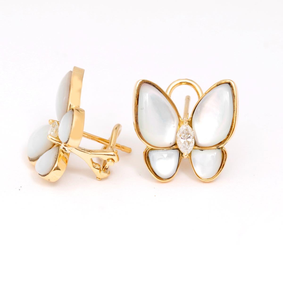 18K Yellow Gold Mother Of Pearl Diamond Butterfly Earrings - . Two Butterfly earrings with Mother Pearl and a diamond middle. 2 Yellow gold earrings weighing  1.42cts diamonds. Omega backs. Total weight 7.5 grams. These dazzling pieces combine color