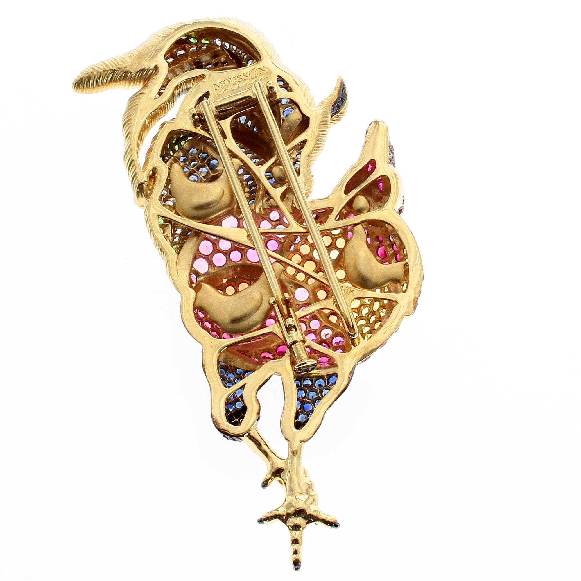 Multi-Color Sapphire 18 Karat Yellow Gold Rooster Brooch
The Body consists of Blue Sapphires, Pink Sapphires and Yellow Sapphires. The tail are hand engraved and set with tsavorites and Blue Sapphire. On the back side all his chicks are with him, as
