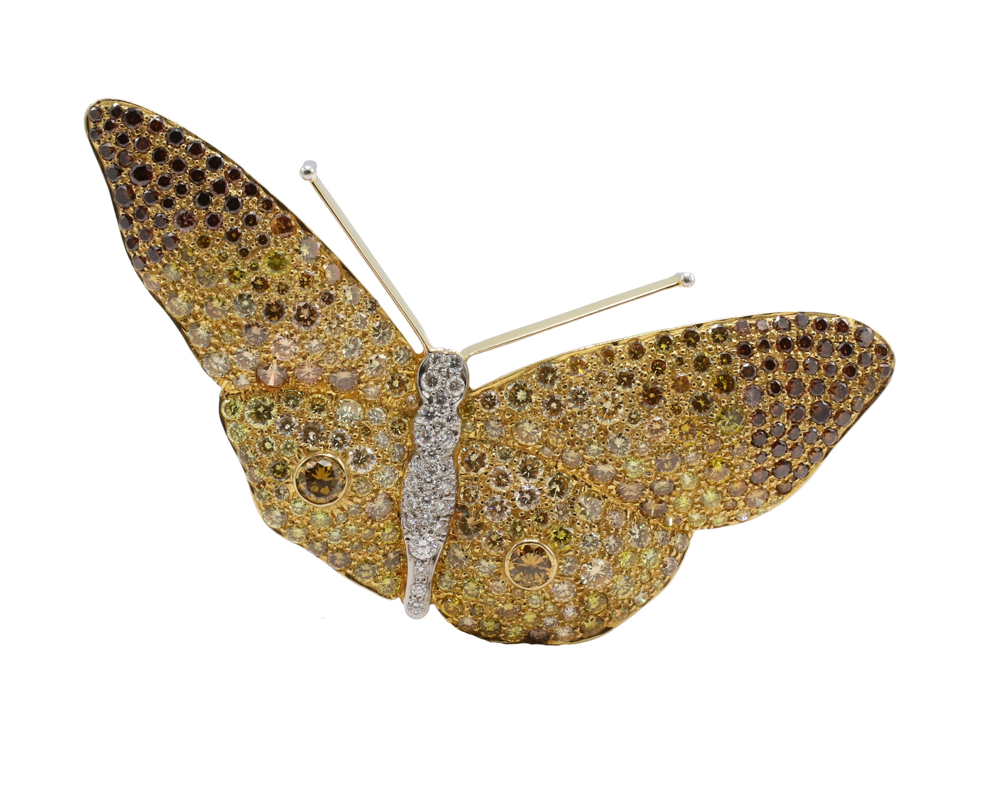 18 Karat Yellow Gold Multi-Colored Natural Diamond Butterfly Brooch Pin 
Metal: 18k yellow gold
Weight: 18.5 grams
Dimensions: 65 x 31 mm 
Diamonds: Approx. 3.00 carats yellow, champaign, brown and white round natural diamonds

