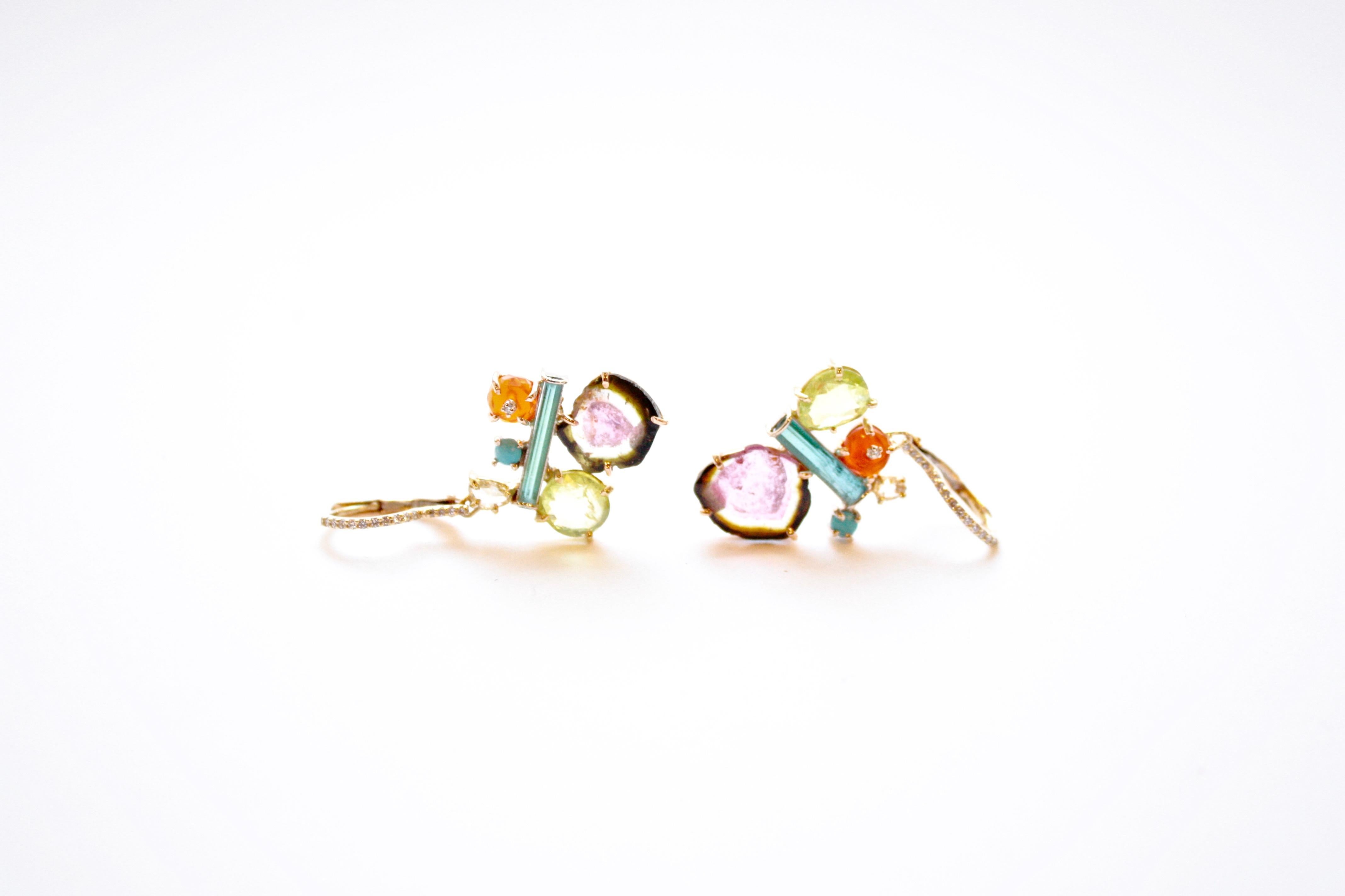 Penny Eardrops
A pair of eighteen-karat yellow gold earrings set with a mélange of different colours and cuts of stones, including Mexican fire opal, tourmaline, turquoise, and chrysoberyl,  along with a dash of diamonds. Each cluster hangs off a