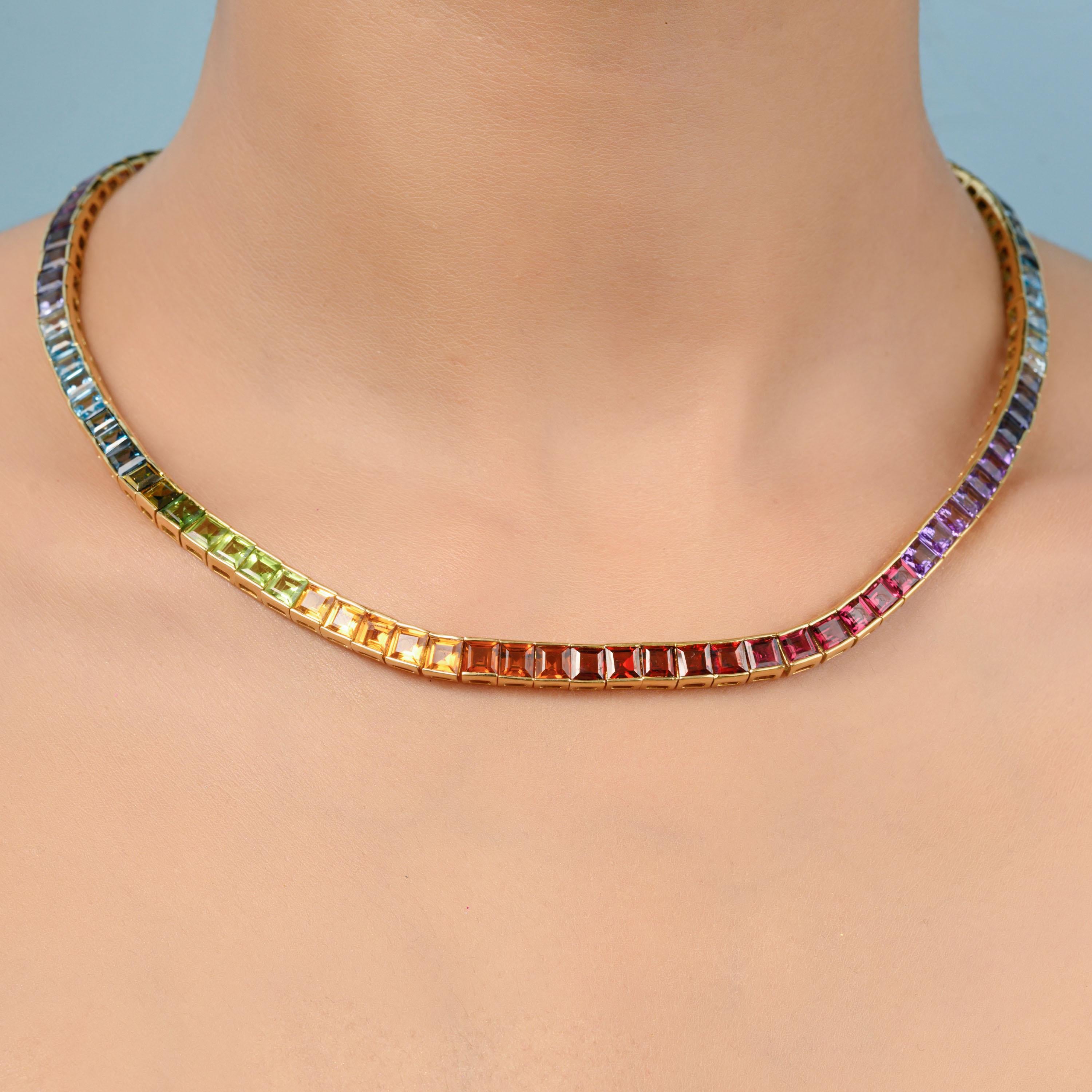 14 karat yellow gold multicolour rainbow natural gemstone tennis line necklace

This seamless multicolour rainbow tennis link necklace set in 18 karat gold is an absolute stunner. The rainbow necklace features lustrous natural gemstones like