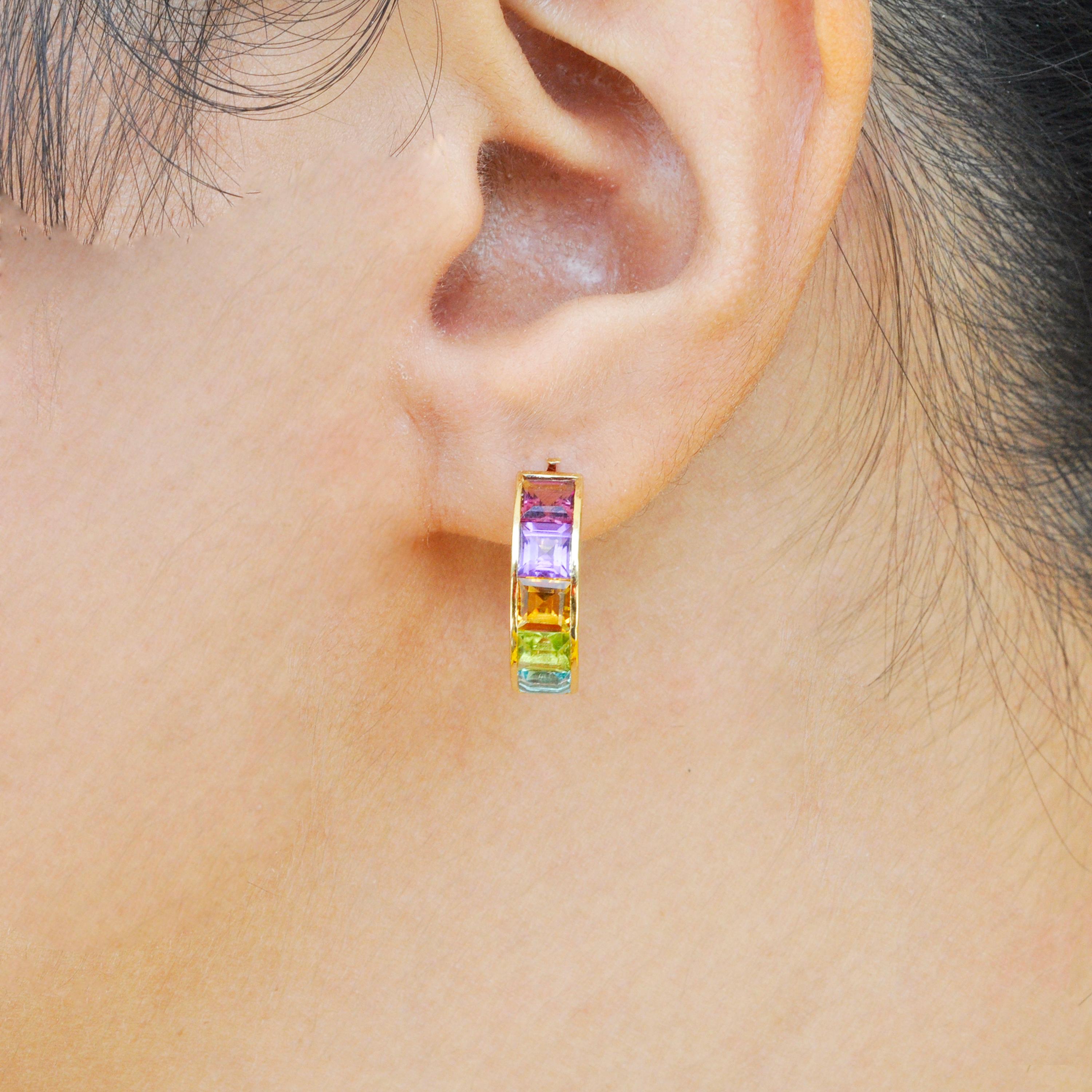 18 karat yellow gold multicolour step cut gemstones linear rainbow hoop earrings

Add something special to your jewellery box with the Multicolour linear Rainbow hoop earrings. Set in 18 Karat gold, this classic linear design features channel set