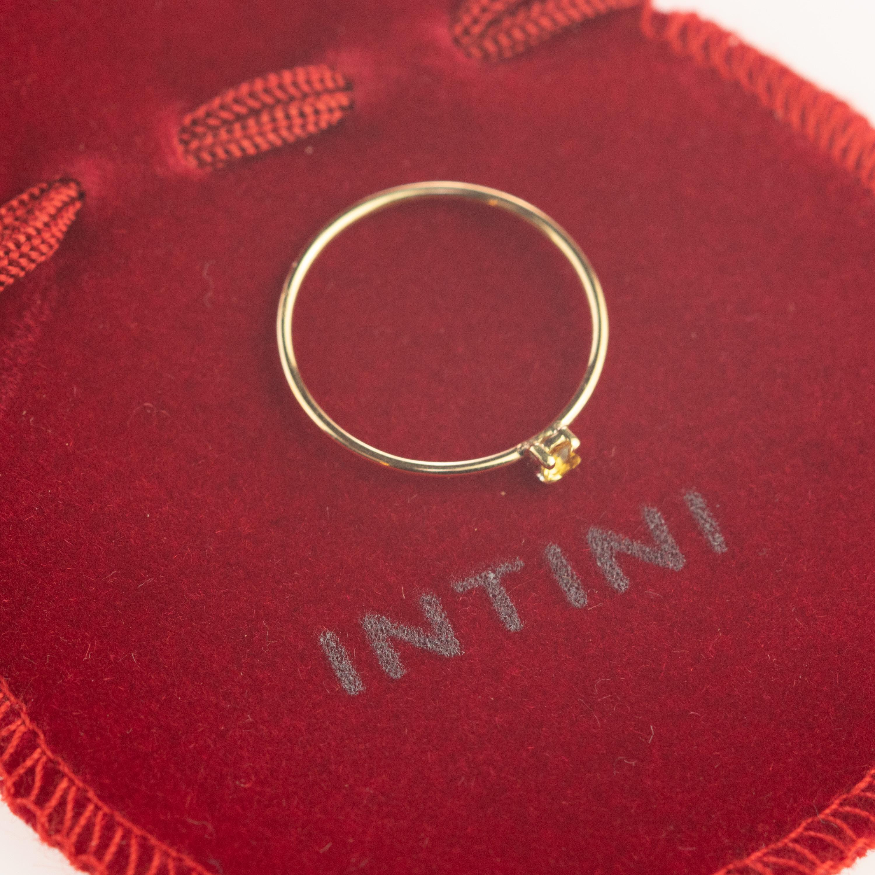 Magnificent ring with an exceptional art work, outstanding display of color and Italian craftsmanship designed by Intini Jewels. This unique ring has a natural round citrine quartz over a 18 karat yellow gold cocktail design. Brilliant cut solitaire