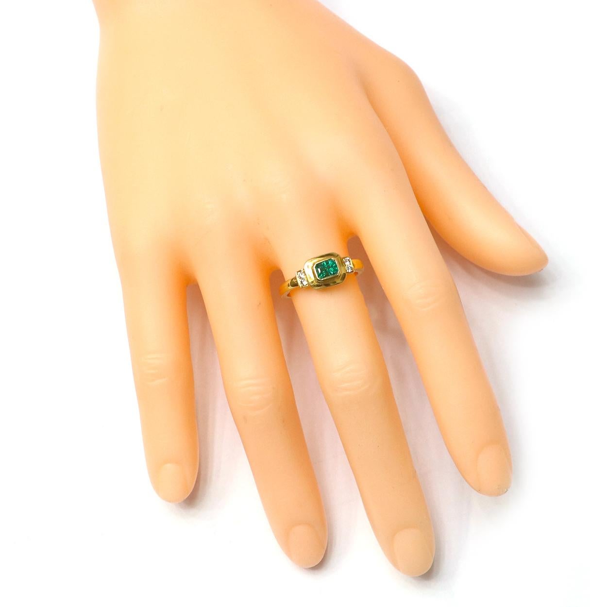 18 Karat Yellow Gold Natural Emerald and Diamond Art-Deco Style Ring

Drawing inspiration from royal heirlooms, this handcrafted ring is iconic. Featuring an emerald-cut, natural emerald encrusted in the center in a closed setting with Brilliant-Cut