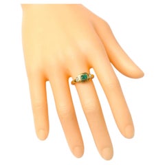 Bague Art-Déco en or jaune 18 carats avec émeraude naturelle et diamant