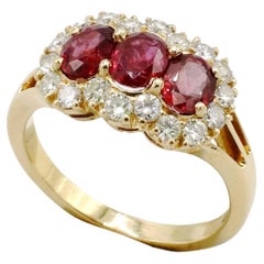 18 Karat Yellow Gold Natural Ruby & Diamond Halo Three-Stone Cocktail Ring
