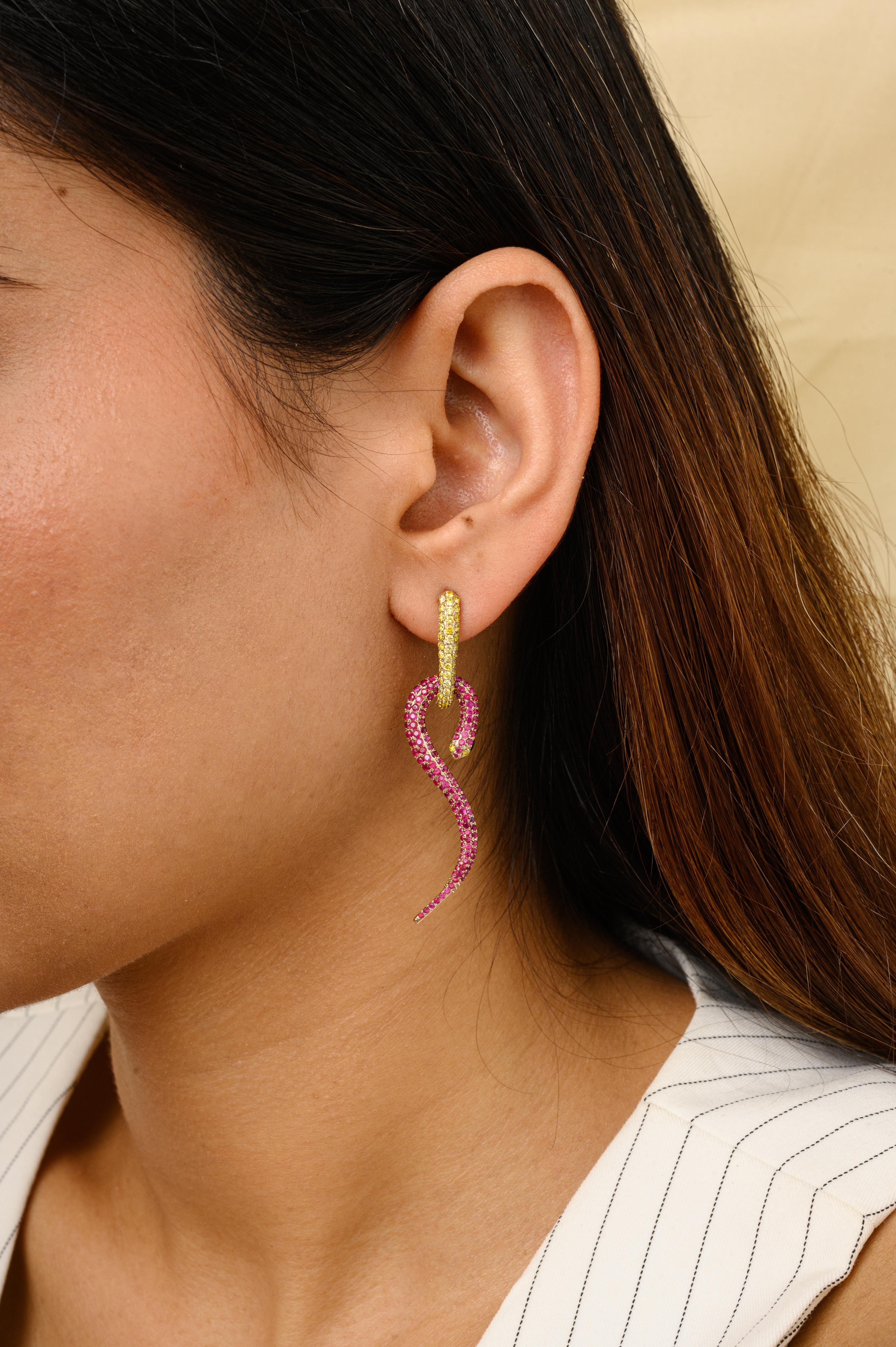 Natural Ruby Diamond Pave Snake Dangle Earrings for Her in 18K Gold to make a statement with your look. You shall need dangle earrings to make a statement with your look. These earrings create a sparkling, luxurious look featuring round cut ruby and
