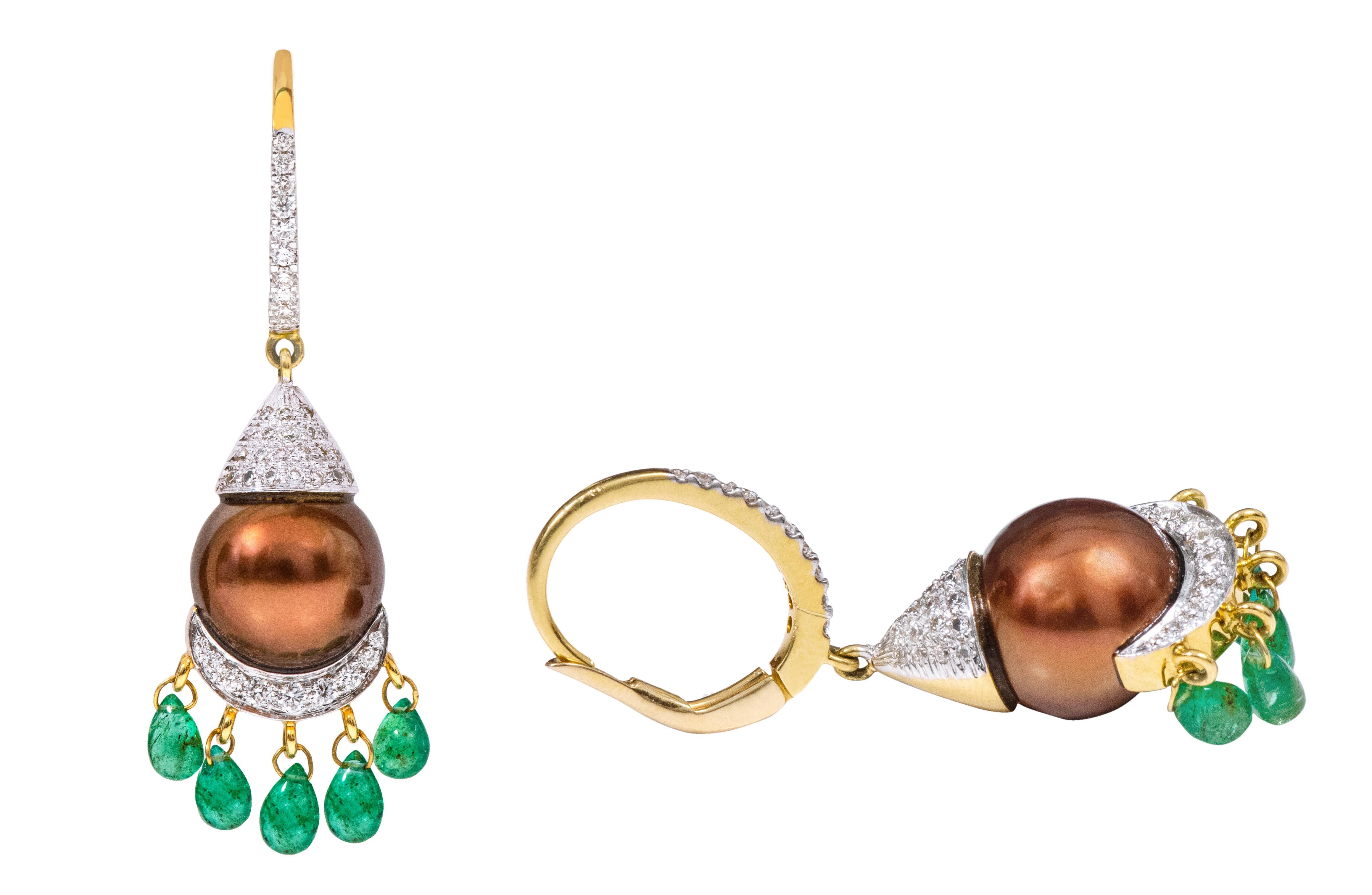 18 Karat Yellow Gold Natural South Sea Pearl, Emerald and Diamond Drop Earrings 

This illustrious brown pearl diamond and emerald drop earring in the two-tone gold combination is scintillating to say the least. The pave diamond oval hoop on the top