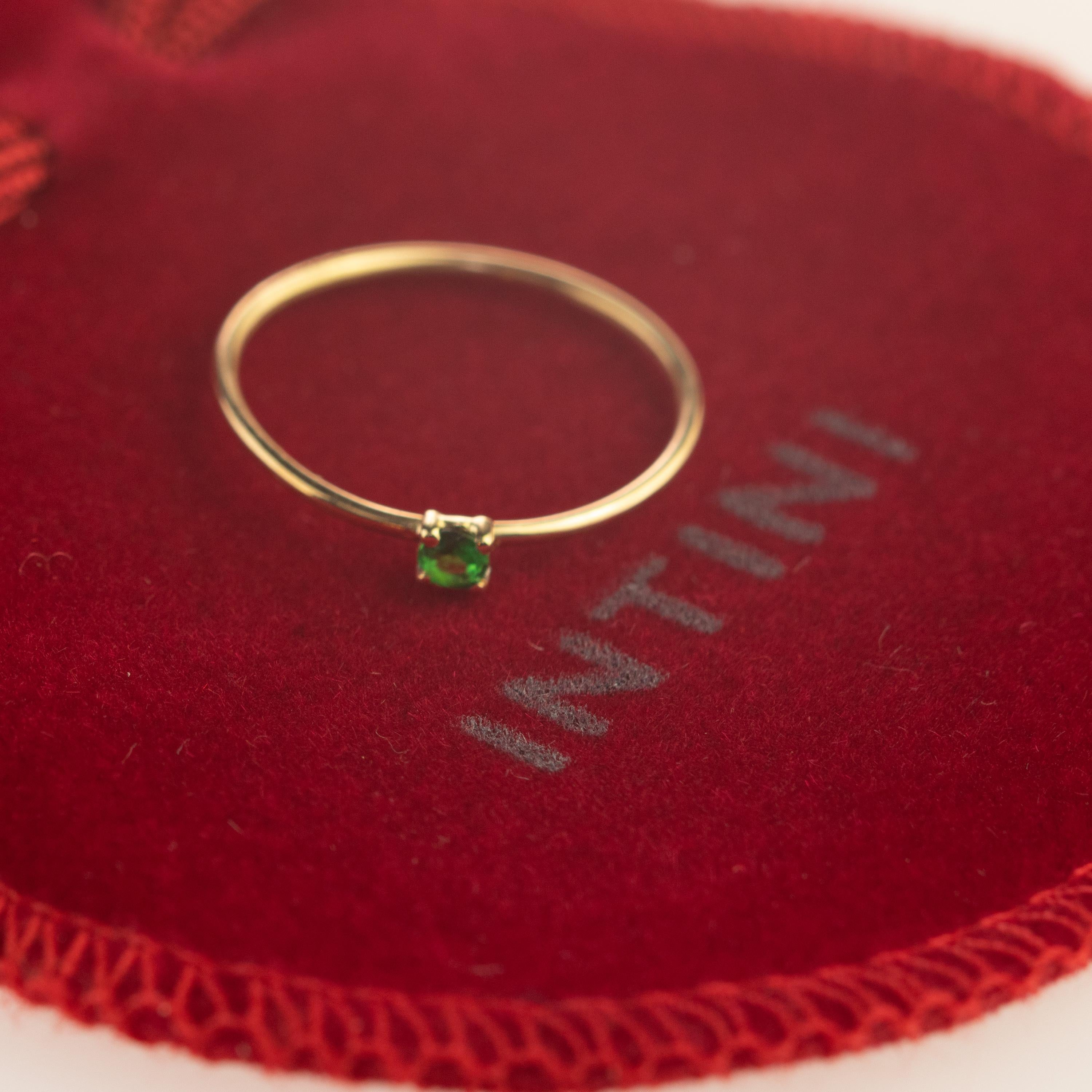 Magnificent ring with an exceptional art work, outstanding display of color and Italian craftsmanship designed by Intini Jewels. This unique ring has a natural round tsavorite over a 18 karat yellow gold cocktail design. Brilliant cut solitaire ring