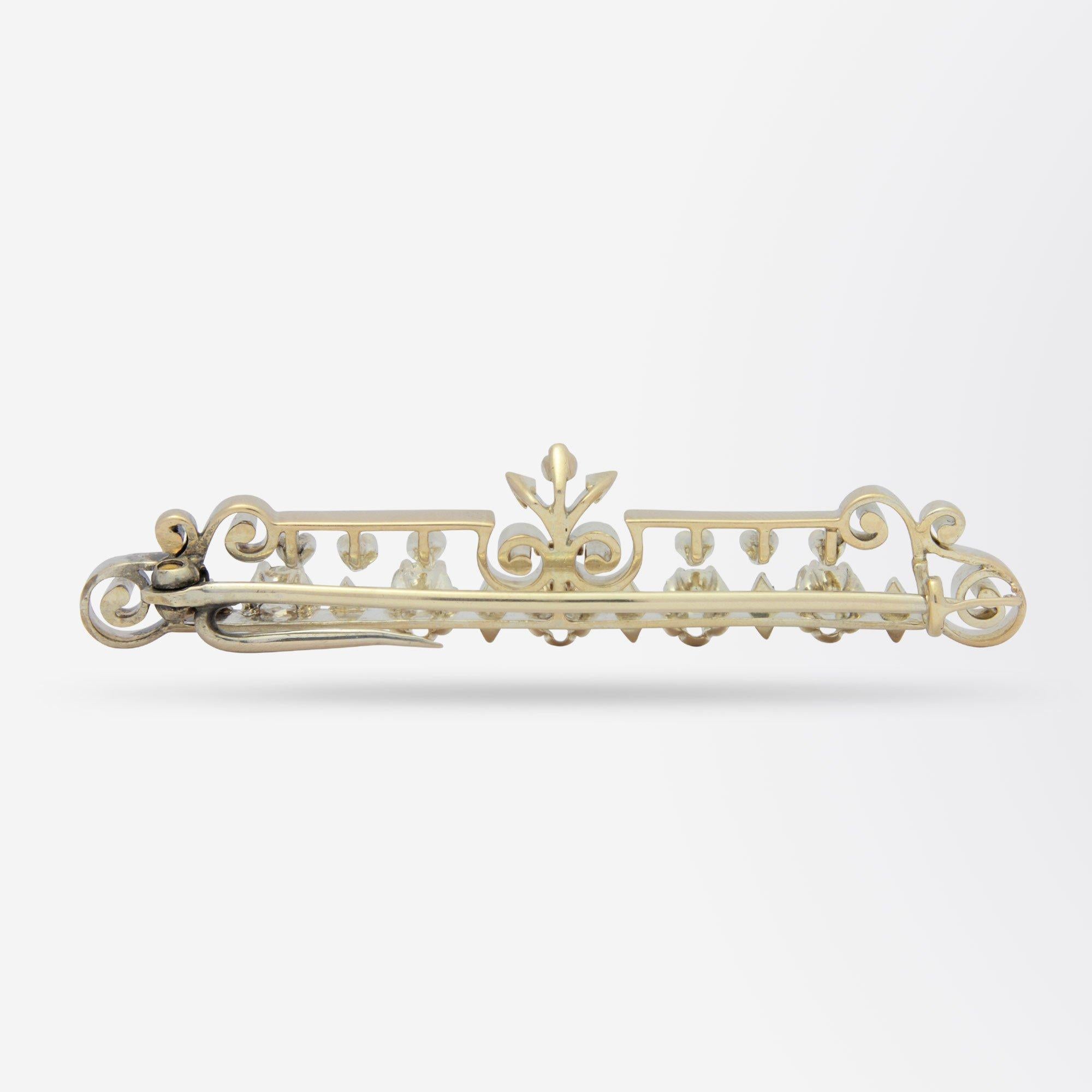 An exquisite handmade yellow gold and diamond bar brooch set with five Old Mine Cut Diamonds. The symmetrical pin has been handcrafted in 18 karat yellow gold and set horizontally with five Old Mine Cut Diamonds of H/I colour and SI clarity