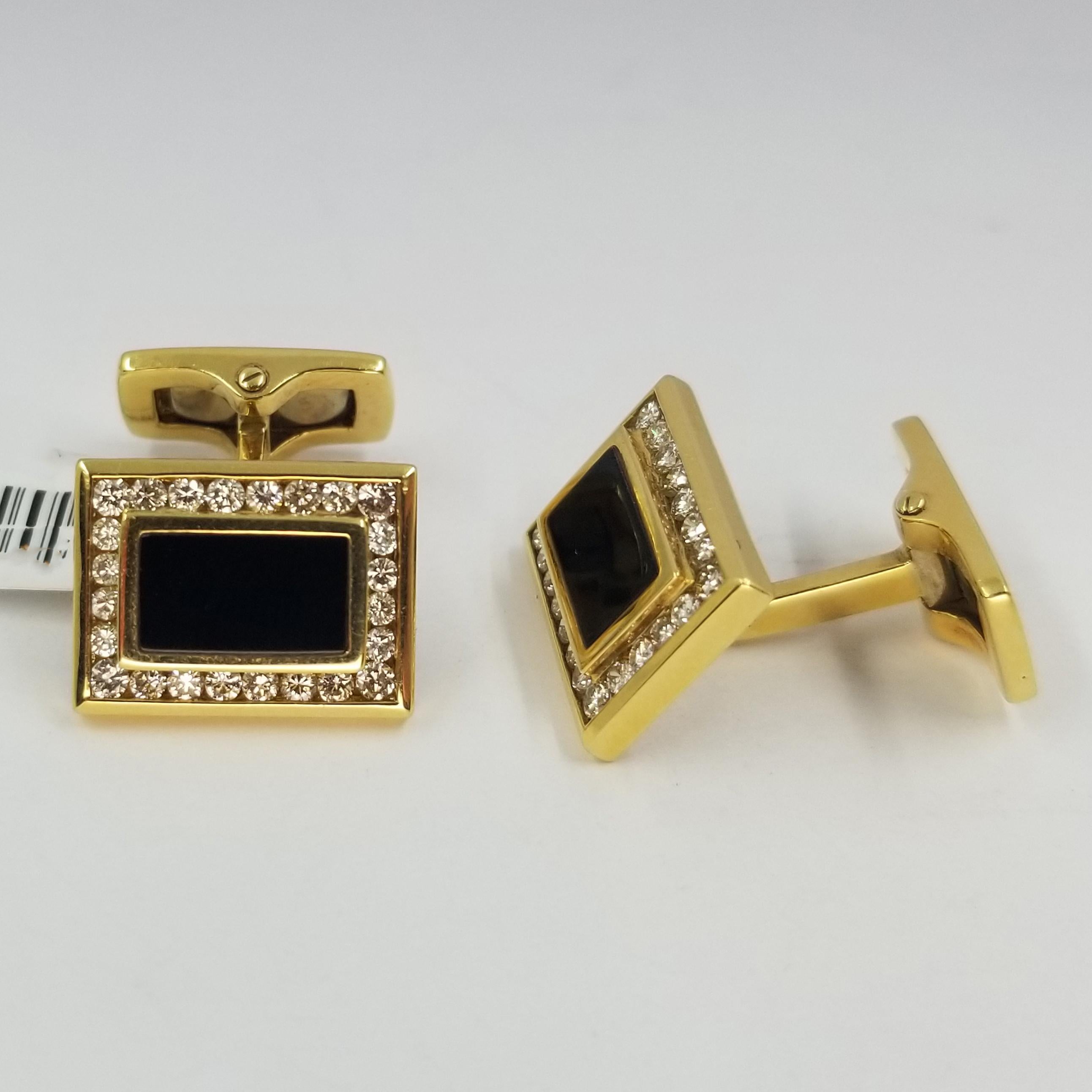 Set of 2 cufflinks crafted in 18 karat yellow gold (stamped 750), onyx, and channel set diamonds. 48 round diamonds of VS clarity & G color total approximately 1.00cttw. Hinged backs for easy dressing and removal.
