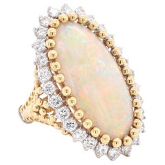 18 Karat Yellow Gold Opal and Diamond Halo Ring