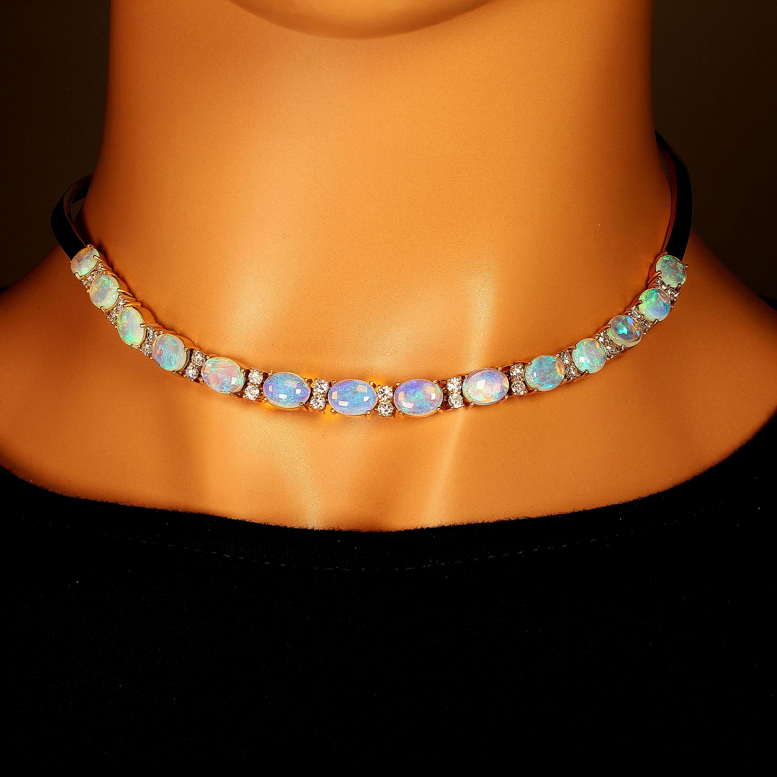 Unique hand made 18K yellow gold, Opal and Diamond necklace.  This one of kind 15 inch collar necklace was created in Rio de Janeiro of 14 oval (8 X 6 MM) Opals with beautiful blue green flashes. These Opals are enhanced with 26 Diamonds of