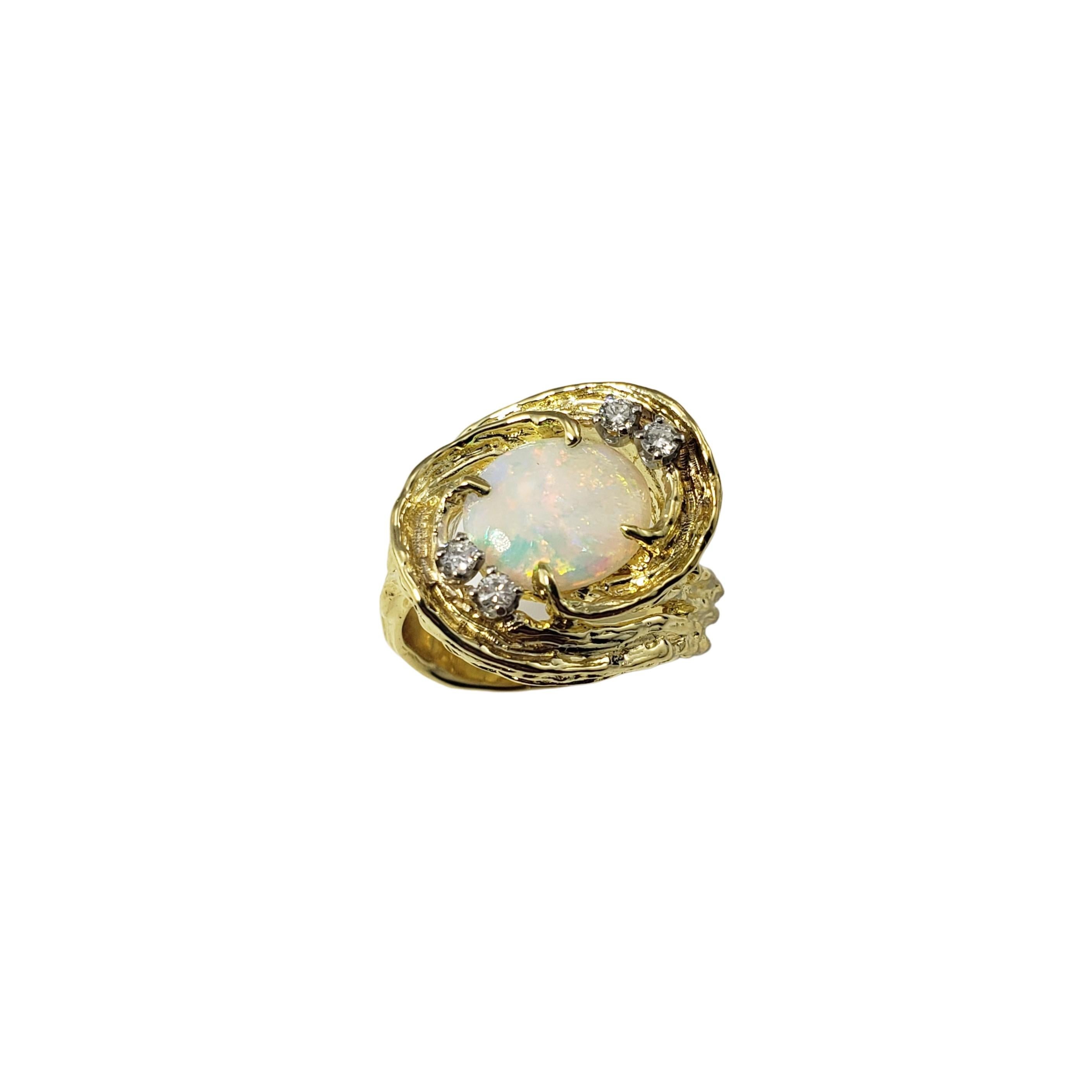 18 Karat Yellow Gold Opal and Diamond Ring Size 7-

This lovely ring features one oval opal (10 mm x 8 mm) and four round brilliant cut diamonds set in beautifully detailed 18K yellow gold.  Width:  18 mm.  Shank:  5 mm.

Approximate total diamond