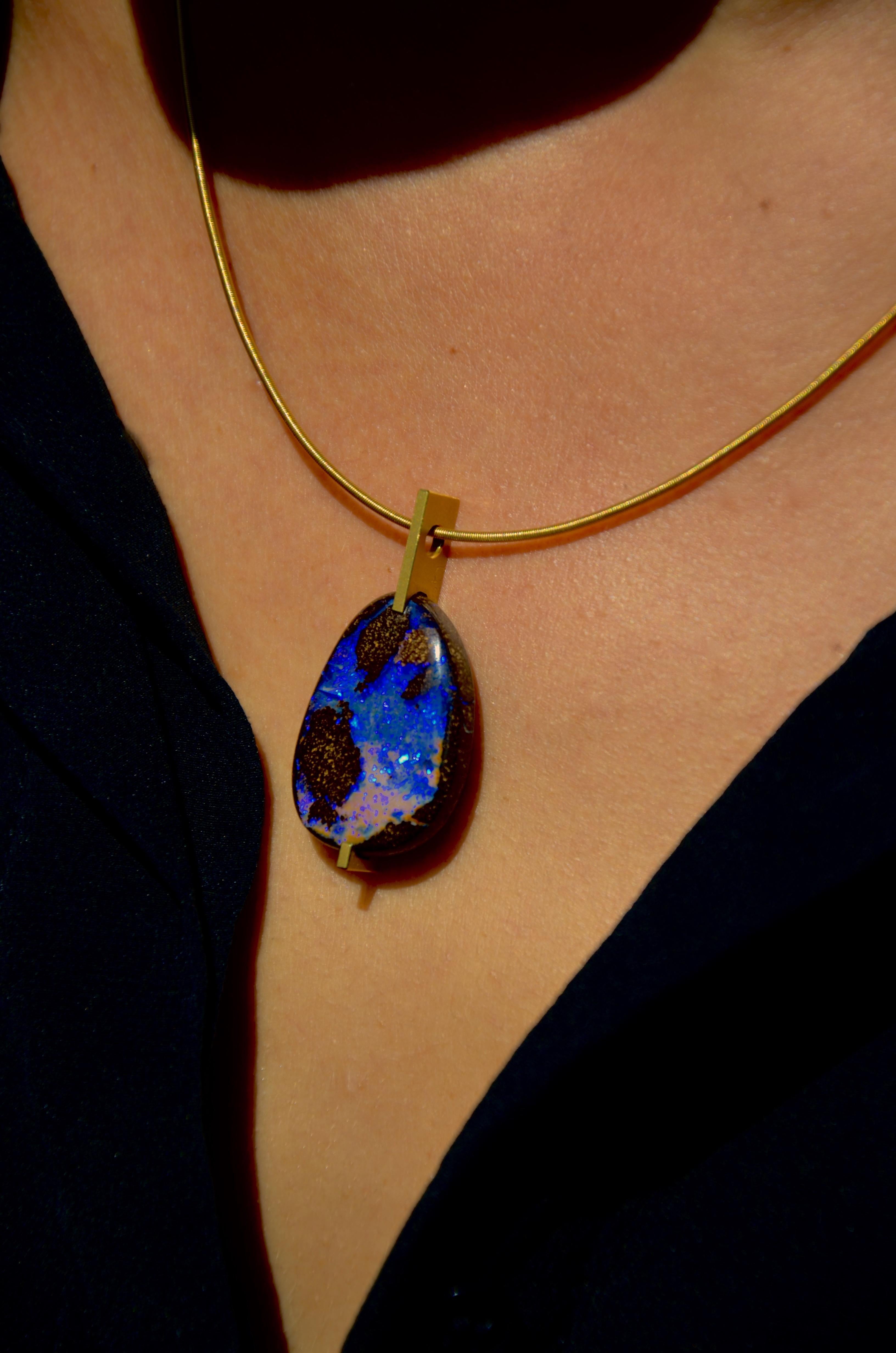 18 karat Gold Opal Pendant 

Boulder Opal in blue, vieolet, pink and many more colours to explore, set in 18 karat Yellow Gold.
Incredibly luminous and colorful, a whole world opens up when gazing at this gemstone. This is the reason Arno Schneider