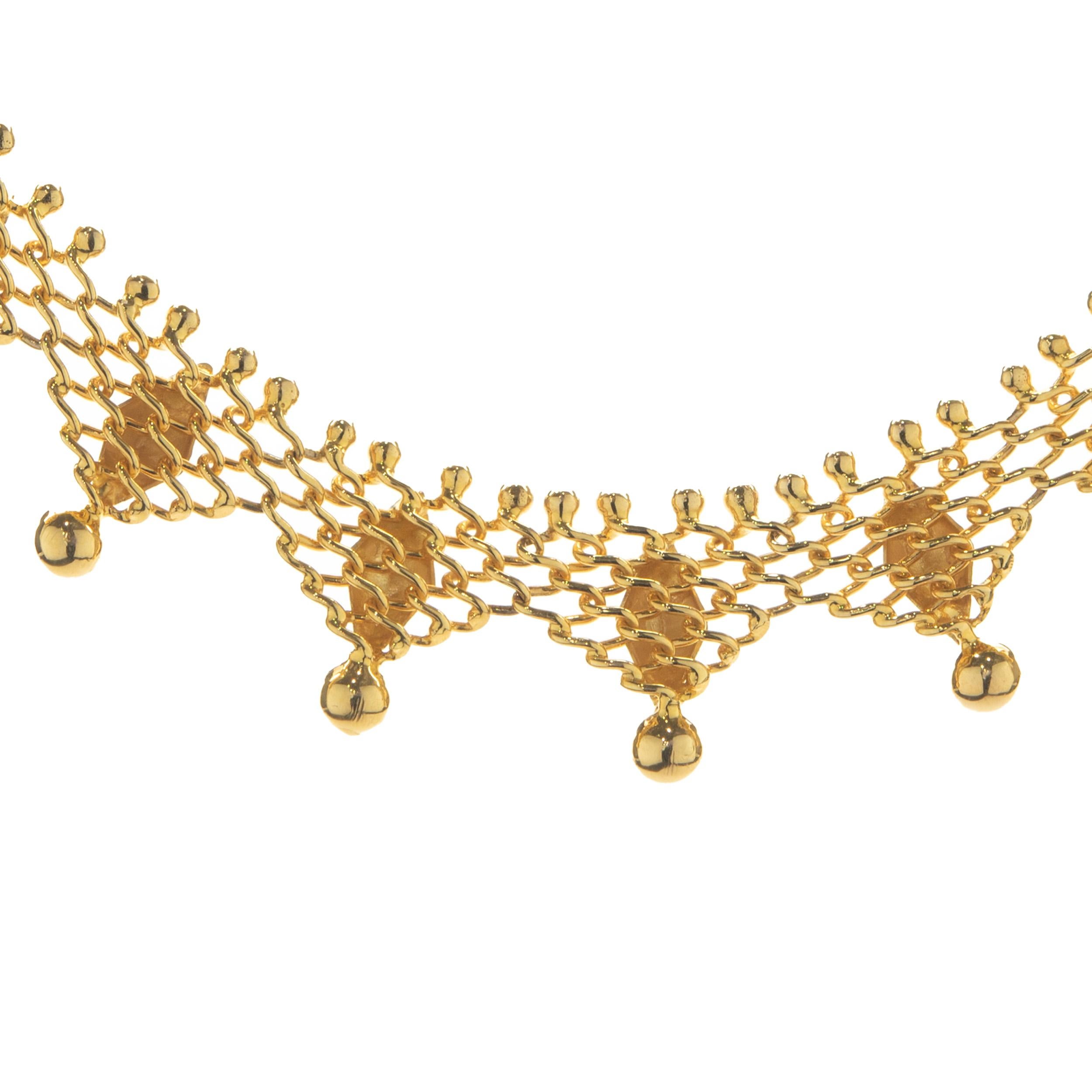 Material: 18K yellow gold
Dimensions: necklace measures 16-inches in length
Weight: 27.42 grams