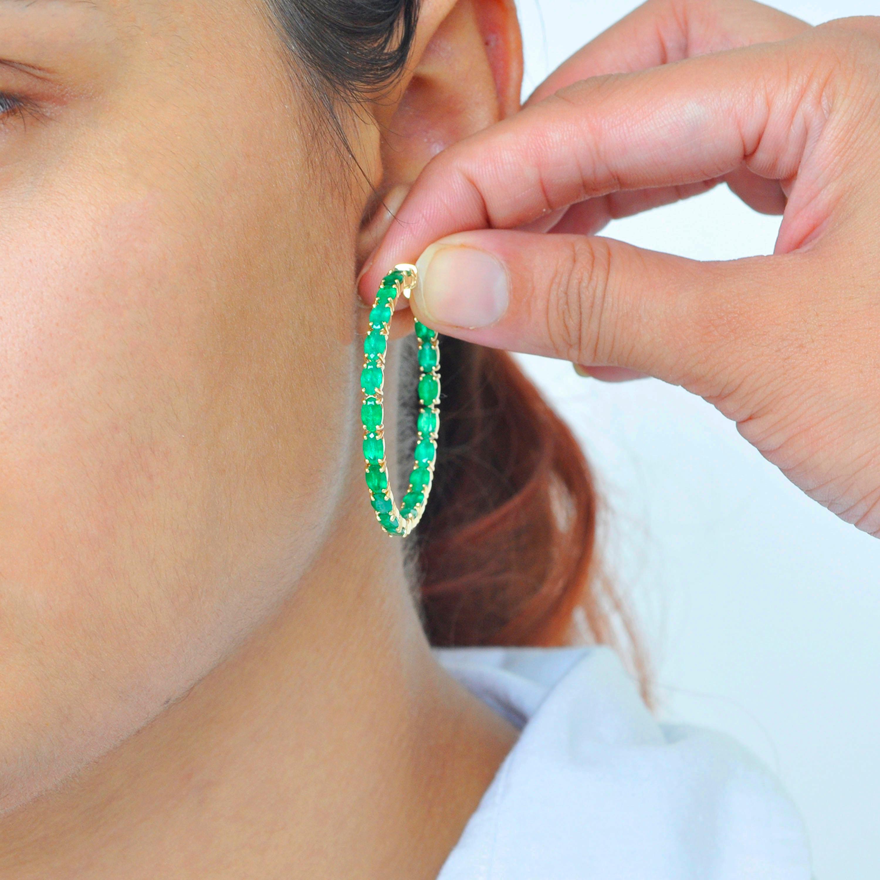 18 karat yellow gold 8.62 carats oval brazilian emeralds hoop earrings. 

This enchanting lush green brazilian emeralds full hoop earring is impressive. The hoop is created with 40 perfect matching oval cut emeralds of size 5x3 mm each. The emeralds