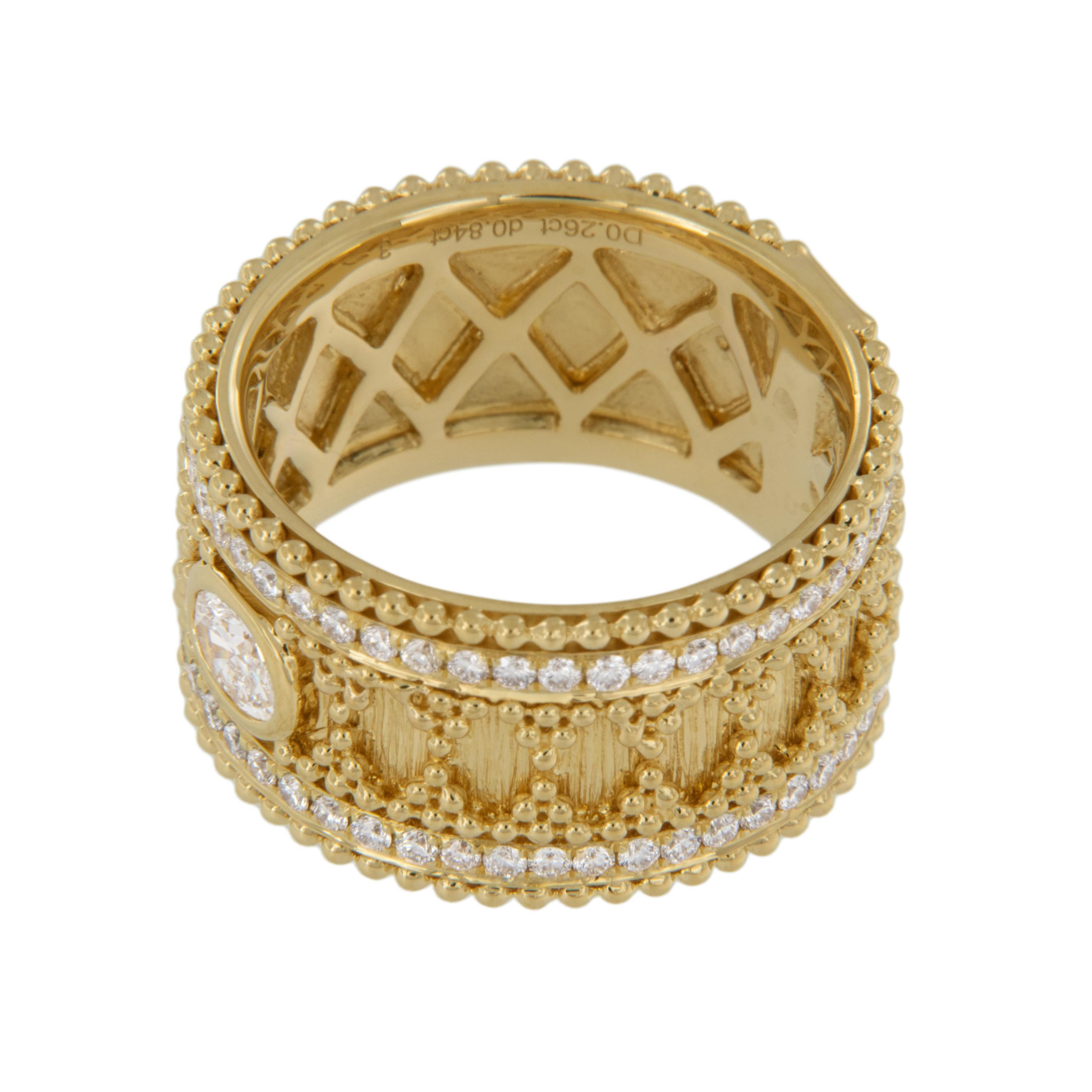 Made from royal 18 karat yellow gold in the classic Byzantine style with intricate granulated beading this knockout band stands out with a 0.29 Ctw oval VS, F-G bezel set diamond & 0.80 RBC diamonds edging it. Ring is a size 7.25, and is 11.33mm