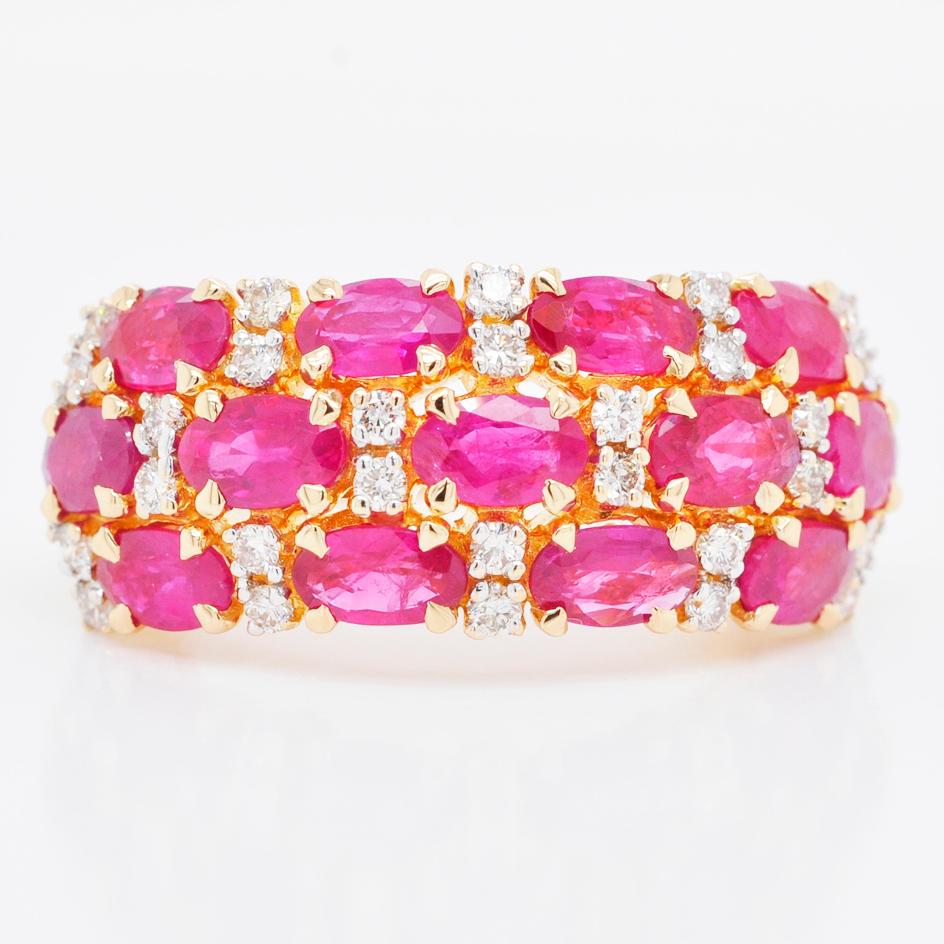 18 karat yellow gold oval ruby cluster band diamond cocktail ring. 

This enchanting oval red ruby and diamond cluster band cocktail ring is impressive. The assortment is created with lustrous oval shaped red rubies along with sparkling VVS/VS - G/H