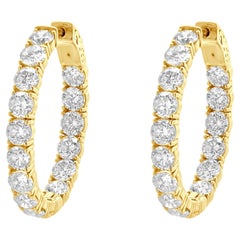 Pendientes de aro de oro amarillo de 18 quilates con diamante de forma ovalada dentro fuera