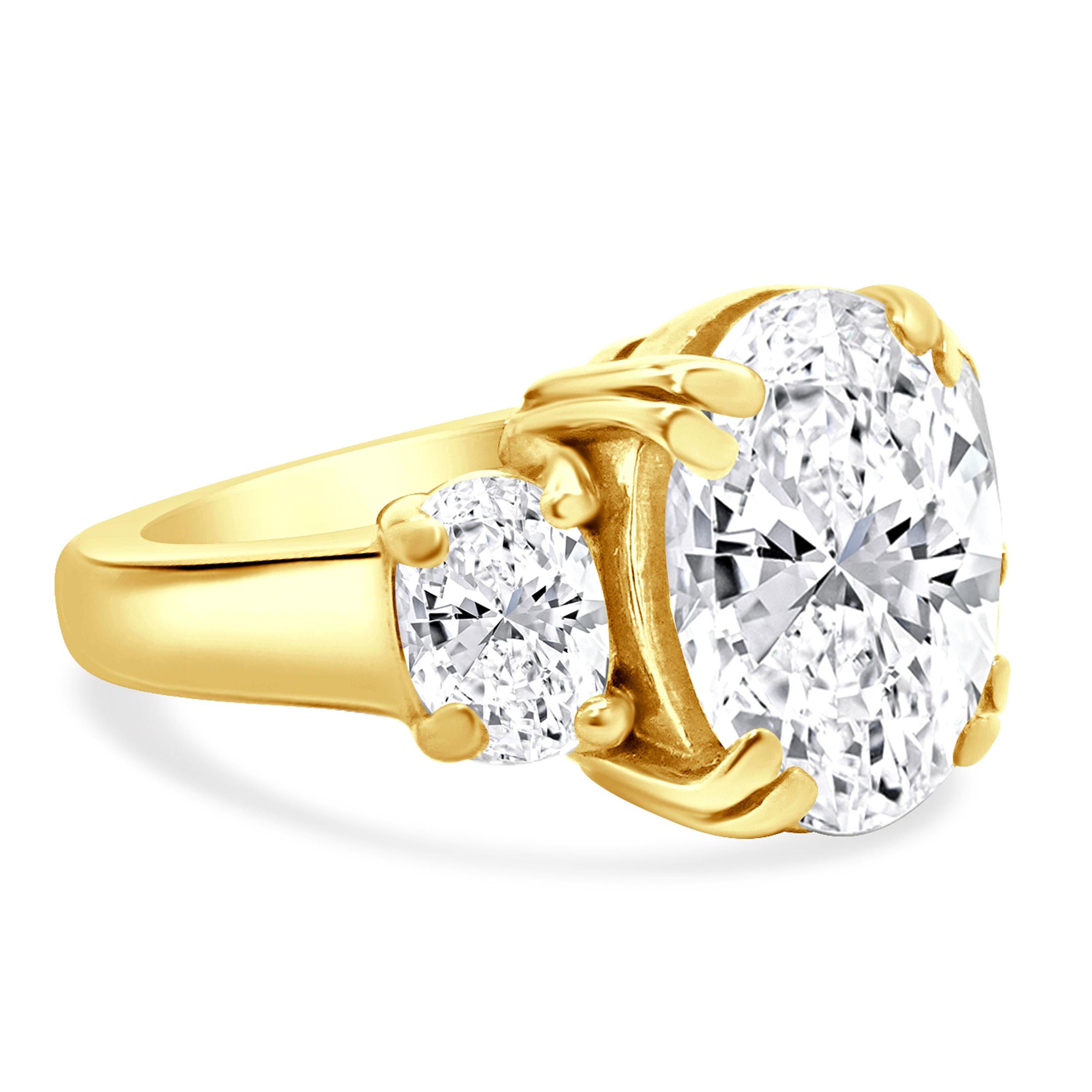 Material: 18K yellow gold
Center Diamond: 1 oval cut = 5.30ct
Color: H
Clarity: SI3
EGL: 2657018332
Diamond: 2 oval cut = 1.50cttw
Color: H/I
Clarity: SI3-I1
Ring Size: 5.25 (please allow up to 2 additional business days for sizing