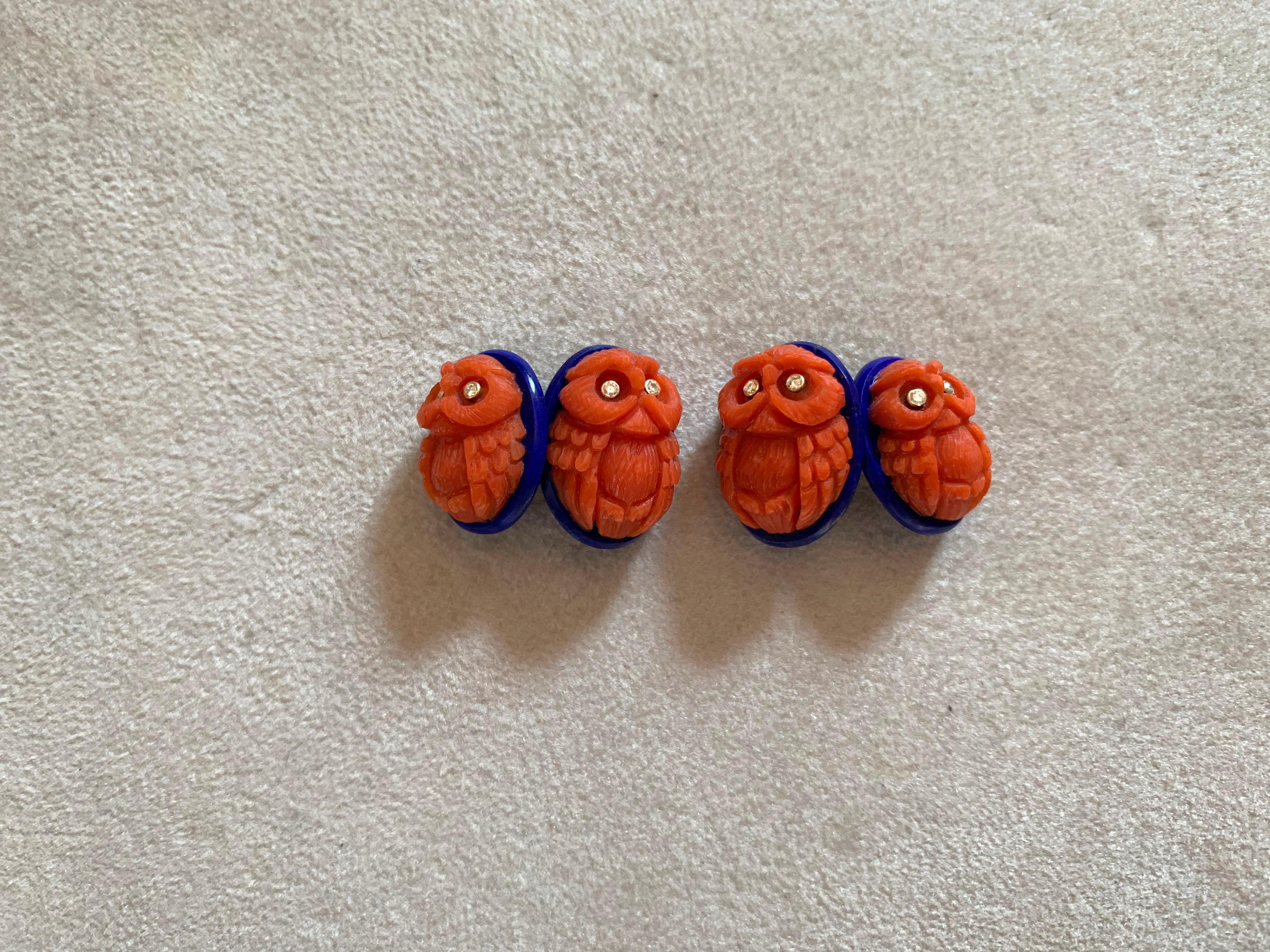 In this amazing pair of cufflinks , front face and toggle are identical and feature the body of a owl vividly hand-carved depicted and made of Mediterranean coral, resting on an oval base made of lapis lazuli. 
Each owl is embellished by two