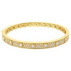 Bracelet jonc en or jaune 18 carats avec chaînes de diamants serties sur le chaton