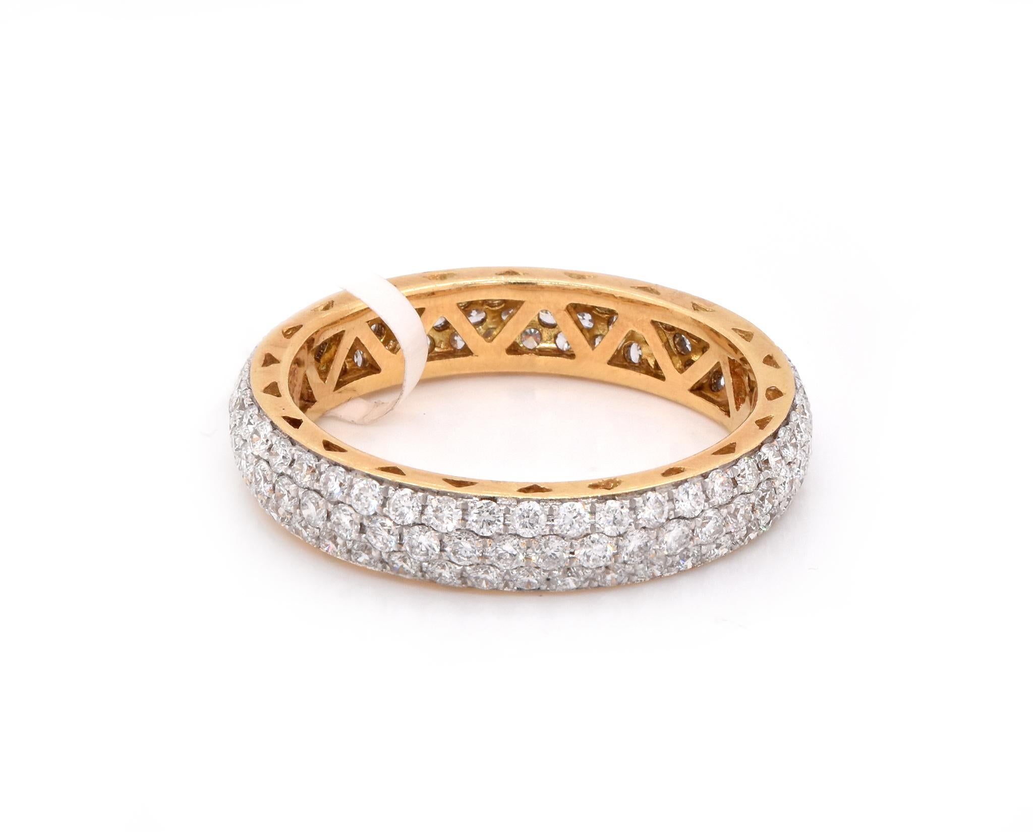 Designer: Custom
Material: 18K yellow gold
Diamonds: 129 round cut = 1.38cttw
Color: G
Clarity: VS
Size: 7
Dimensions: ring measures 4mm in width
Weight: 3.90 grams
