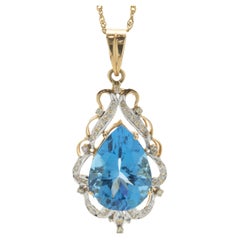 18 Karat Yellow Gold Pear Cut Blue Topaz and Diamond Freeform Pendant