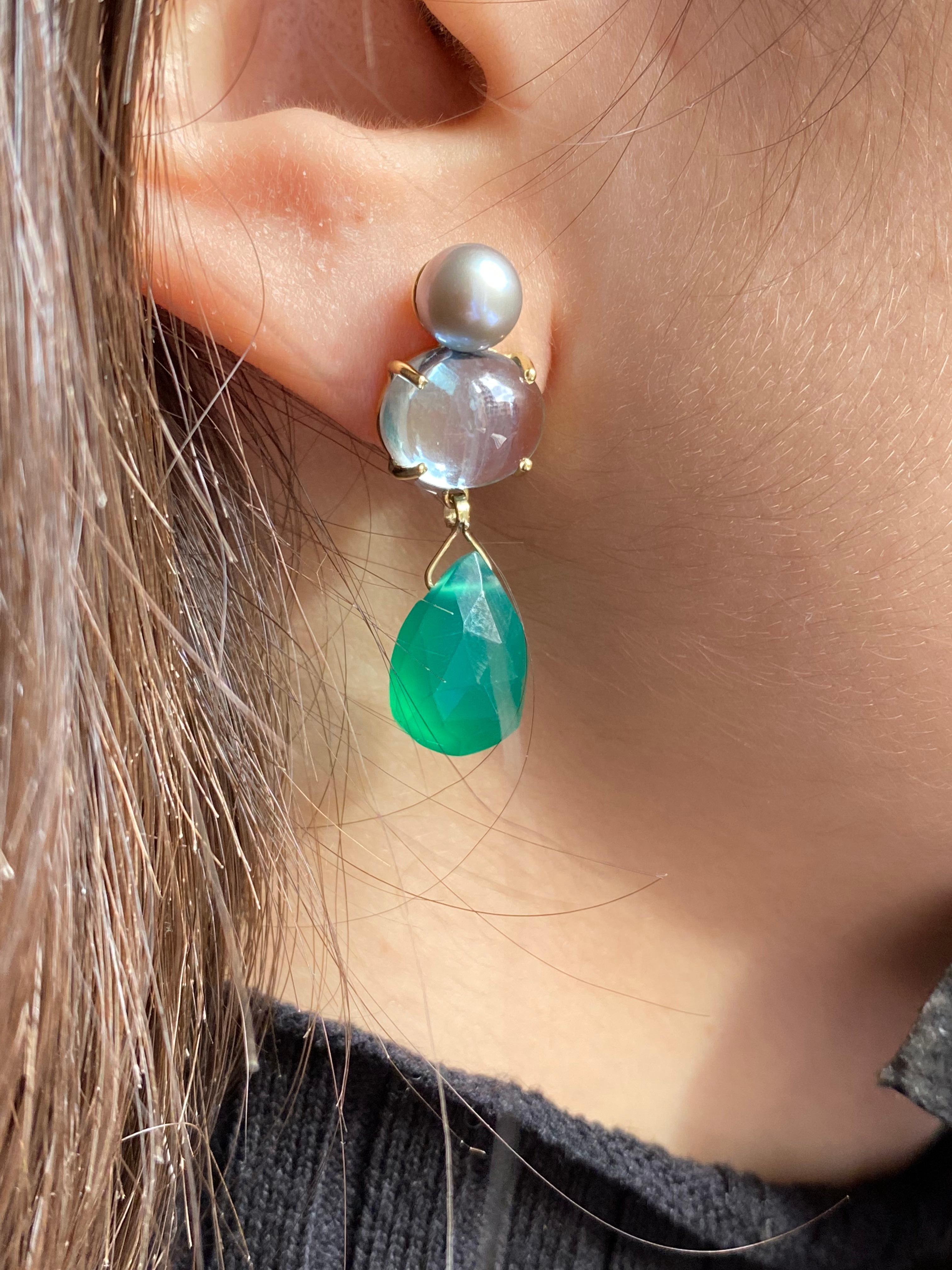 Experience the allure of Rossella Ugolini's Design Collection, where elegance meets nature's hues. Crafted in 18 Karat Yellow Gold, these earrings showcase a serene light blue and green palette with Light Blue Topaz and a deep green Agate.

The