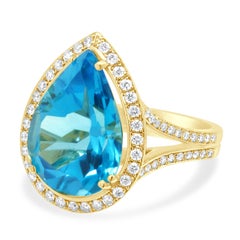 18 Karat Yellow Gold Pear-Shaped Blue Topaz and Round Diamond Halo Ring