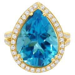18 Karat Yellow Gold Pear-Shaped Blue Topaz and Round Diamond Halo Ring