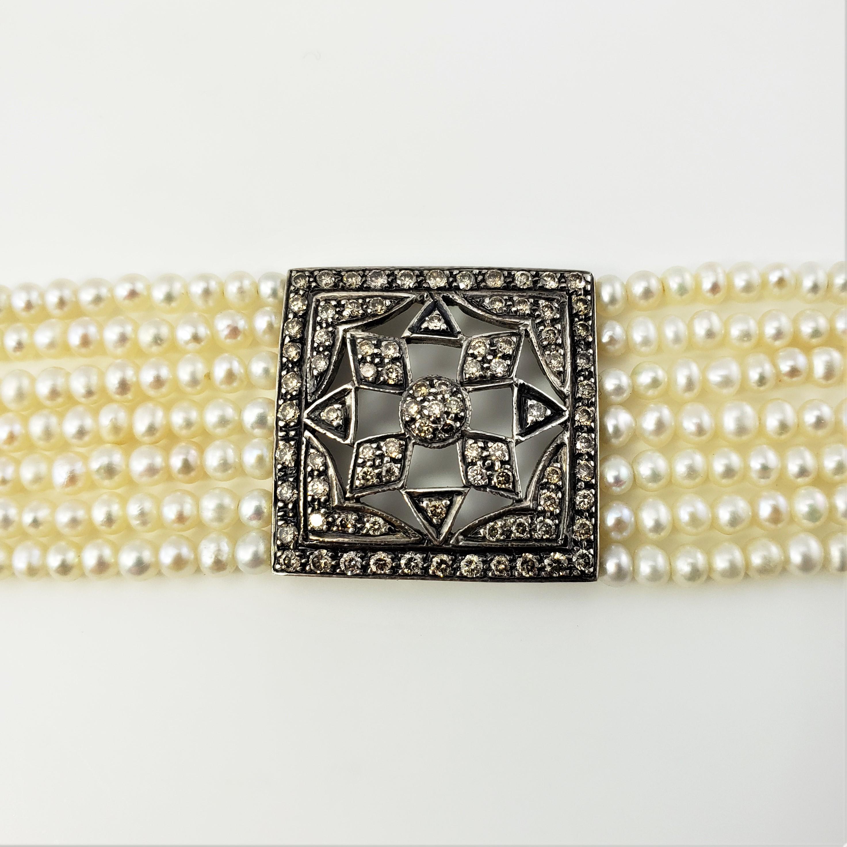 Armband aus 18 Karat Gelbgold mit Perlen und Diamanten Damen