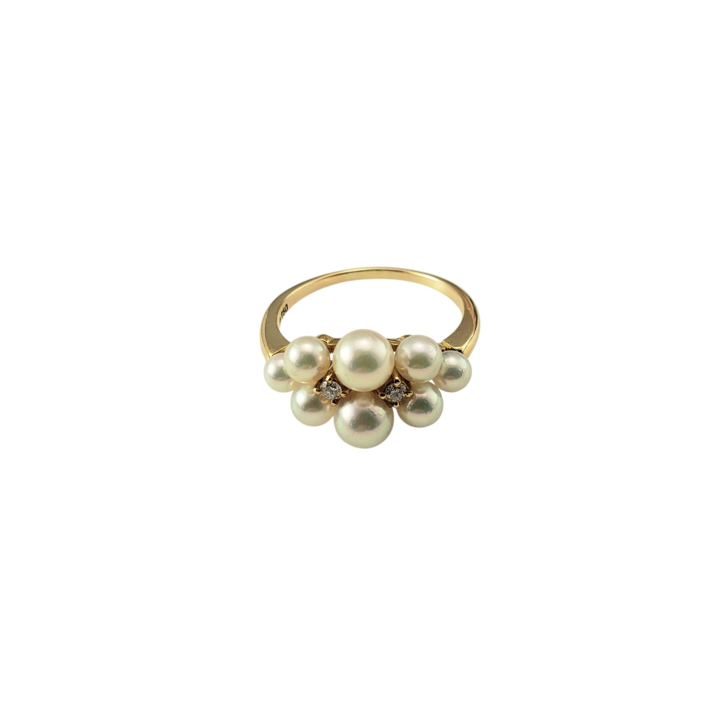 18 Karat Yellow Gold Pearl and Diamond Ring Size 7

This graceful 18K yellow gold ring features a stunning cluster of eight white pearls arranged in a soft arc, accented by two sparkling brilliant cut diamonds nestled between them. A beautiful blend
