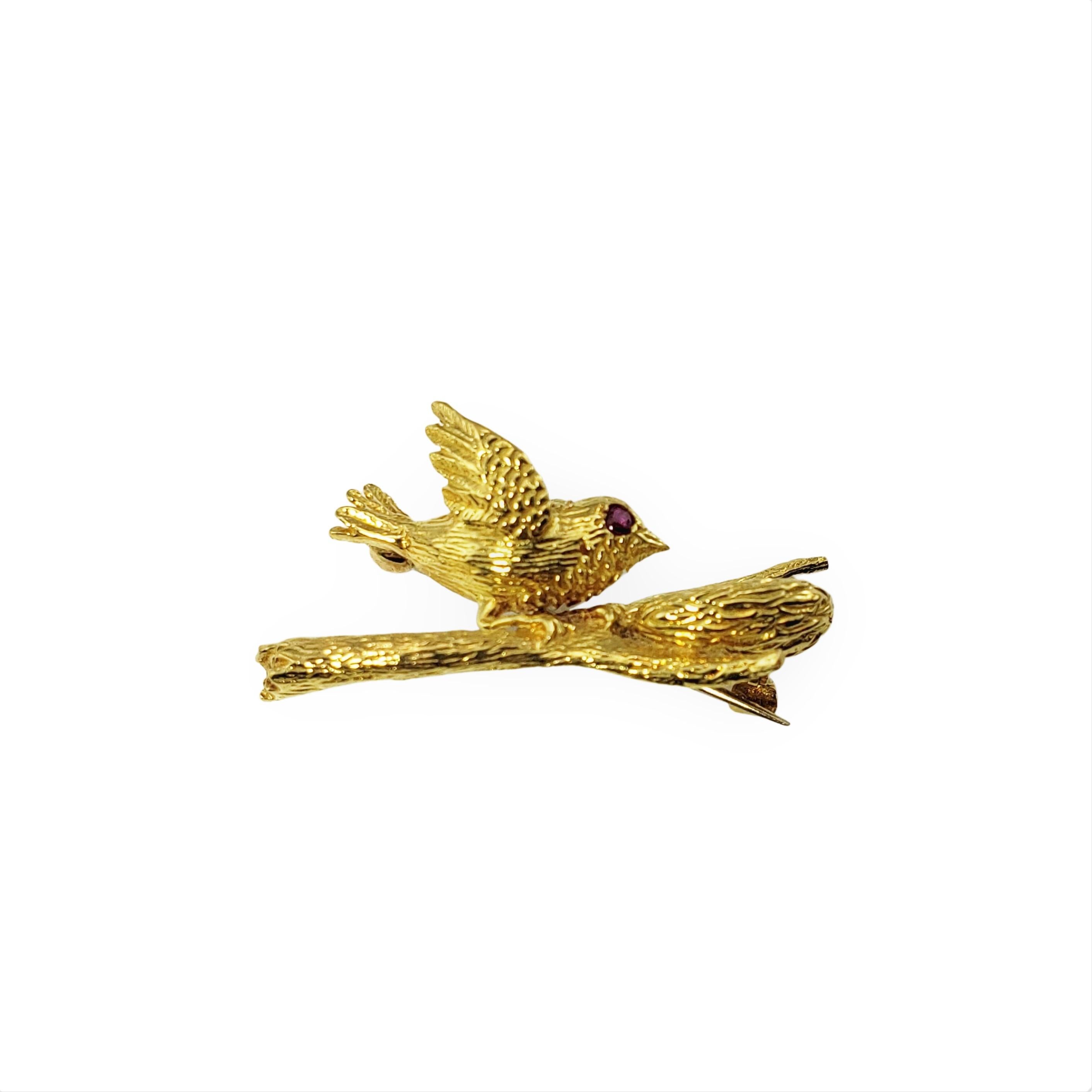 18 Karat Yellow Gold, Pearl and Ruby Bird and Nest Brooch/Pin-

This exquisite brooch features a beautifully detailed bird looking protectively over her nest of three cultured white pearl 